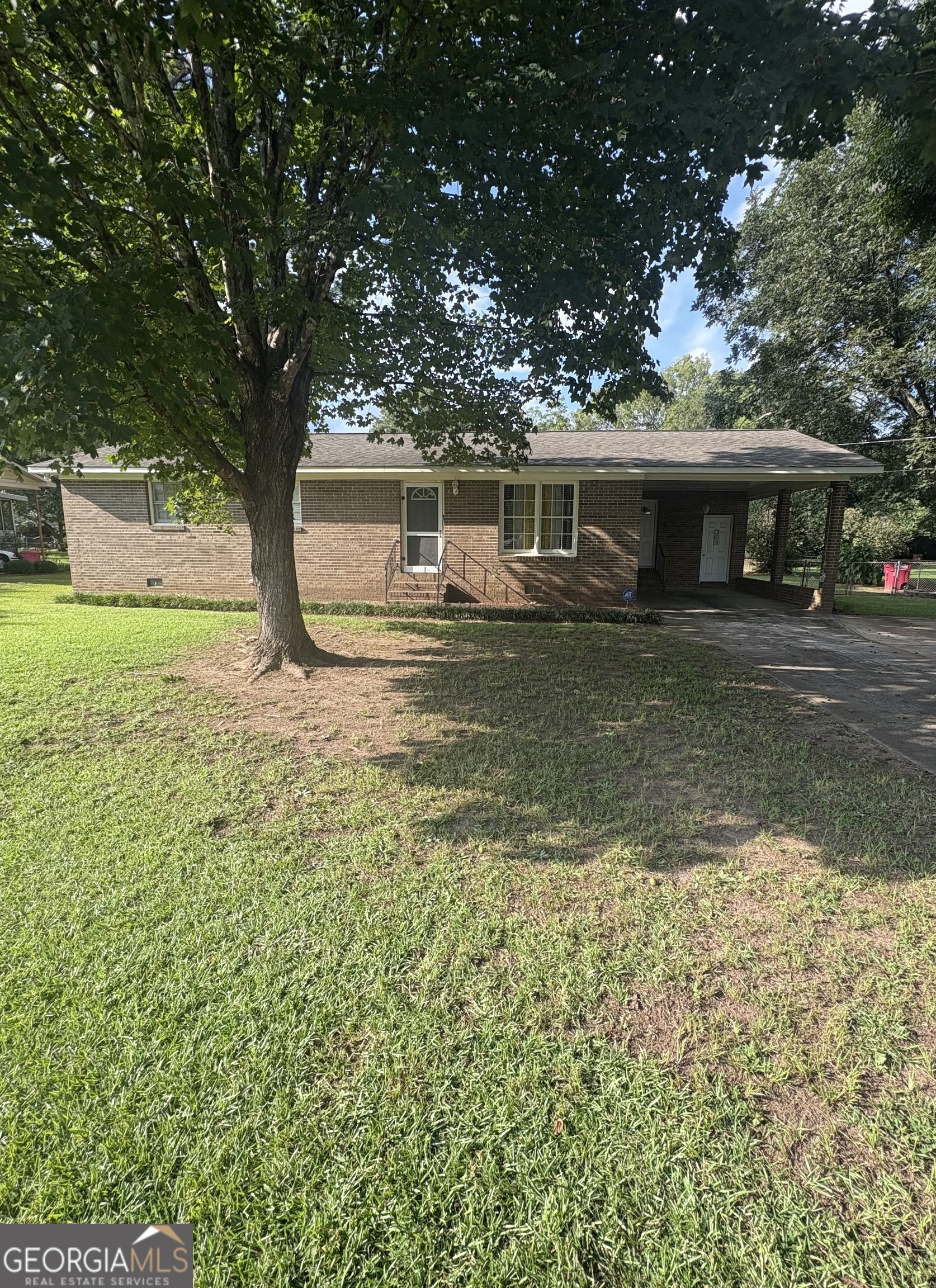 This charming 3-bedroom, 2-bath home offers 1,264 sq. ft. of comfortable living space on a 0.46-acre lot. Well-maintained, it features a roof and HVAC system approximately 7 years old. The kitchen is equipped with a gas range, dishwasher, and stainless steel refrigerator. Carpet cleaning will be professionally completed before closing, and extra flooring will remain should the new homeowner prefer an alternative to carpet. A 10' x 16' storage building with electricity and water provides excellent space for tools, equipment, or hobbies. The fenced backyard offers privacy and plenty of room to enjoy outdoor living. Conveniently located just minutes from shopping, dining, and schools, this home combines comfort, functionality, and location. Don't miss this opportunity-schedule your showing today!