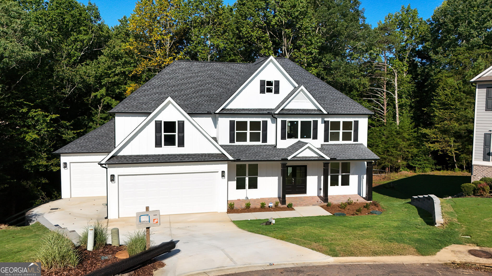 New Construction /Brand New in Forsyth County- Luxury 5BR/4BA Home Near Lake Lanier!!!! Brand-new 3,500 sq ft home with 5 bedrooms, 4 baths, plus a ~2,100 sq ft full unfinished basement in Forsyth County, less than a mile from Lake Lanier! Features include a spacious living room, formal dining, media room, and chef's kitchen with quartz counters and huge walk-in pantry. All baths fully tiled with frameless showers; spa-like primary suite with soaking tub. Waterproof LVP flooring throughout. Covered deck with wooded views and creek. Basement with 11' ceilings and large windows. 3-car garage & backyard with space for pool.