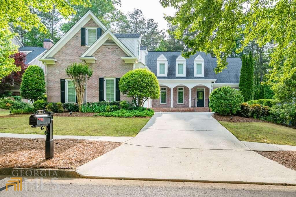 Here is your chance - don't miss out! This spacious home boasts 5 bedrooms and 4.5 baths with over 7,000 sq ft and features hard to find master and guest bedroom on the main floor. Located on a cul-de-sac of the beautiful tree lined streets of popular Burnt Hickory Registry (a swim tennis neighborhood near shopping and Kemp Farms Park), in the sought after district of Harrison High School. This beautiful John Hicks custom home has a private back yard with a New Orleans style courtyard and patio. Loaded with upgrades: hardwood floors on main, pella windows, and plantation shutters throughout the house. Open kitchen with large island, custom Kitchen Works cabinets, double sinks, granite countertops, breakfast bar. Opens to the sunroom and 2 story great room. There are 2 pantries with double sided swing out shelves. Shelving for cookbooks and 2 glass front lighted cabinets. Large dining room with chandelier and wall sconces. 2 Story Great Room with Gas Log Fireplace, Wood Mantle & Built-In Cabinets. Music Room/Living Room. French Pocket Doors with Transom. Crystal Ceiling Fixture. Closet with Built-In Shelves. Powder Room with Hardwood Floors. 2 Story Sunroom with Maui Bay Ceiling Fans, Tile Floors & Built-In Speakers. Spacious Master Bedroom with Wall Sconces & Ceiling Fan. Master Bath with Double Marble Vanity. Jetted garden tub. Separate Shower. Marble floors. Closet with Custom Shelving, Built-Ins, and Clothes Hamper. Access to Sunroom. Huge laundry room with cabinets, cast iron sink and utility closet. Veranda off sunroom with speakers and spiral staircase to the lower patio. Upper floor: 3rd Bedroom with 3 Dormer Windows & Huge Closet. Full Bath with Separate Shower, Pocket Doors, Linen Closet & Tile Floors. 4th Bedroom with 2 Dormer Windows & Vaulted Ceiling. Bonus Room/Office. Awesome entertaining space on the terrace level: Kitchen/Bar by Kitchen Works with Brass Foot Rail. Pantry. Mirror/Glass Wall Feature. A Media/Billiard Room with Chair Rail, Ceiling Fans, Gas Log Fireplace with Marble Surround, Built-In Cabinets, Game Table Nook & Surround Sound System. 5th Bedroom with Full Bath. Large Unfinished Storage Area & Exterior Storage Room. You can also enjoy these extra features: Landscaping & Lighting by Top Notch Landscaping, Irrigation System, Alarm System, Trane HVAC Units Serviced Every 6 Months, 2 Co 50 Gallon Water Heaters, 16 kW Generac Generator, Intercom System, and a Whole House Vac.