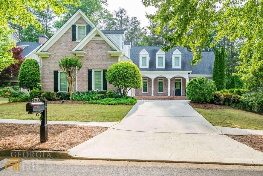 Here is your chance - don't miss out! This spacious home boasts 5 bedrooms and 4.5 baths with over 7,000 sq ft and features hard to find master and guest bedroom on the main floor. Located on a cul-de-sac of the beautiful tree lined streets of popular Burnt Hickory Registry (a swim tennis neighborhood near shopping and Kemp Farms Park), in the sought after district of Harrison High School. This beautiful John Hicks custom home has a private back yard with a New Orleans style courtyard and patio. Loaded with upgrades: hardwood floors on main, pella windows, and plantation shutters throughout the house. Open kitchen with large island, custom Kitchen Works cabinets, double sinks, granite countertops, breakfast bar. Opens to the sunroom and 2 story great room. There are 2 pantries with double sided swing out shelves. Shelving for cookbooks and 2 glass front lighted cabinets. Large dining room with chandelier and wall sconces. 2 Story Great Room with Gas Log Fireplace, Wood Mantle & Built-In Cabinets. Music Room/Living Room. French Pocket Doors with Transom. Crystal Ceiling Fixture. Closet with Built-In Shelves. Powder Room with Hardwood Floors. 2 Story Sunroom with Maui Bay Ceiling Fans, Tile Floors & Built-In Speakers. Spacious Master Bedroom with Wall Sconces & Ceiling Fan. Master Bath with Double Marble Vanity. Jetted garden tub. Separate Shower. Marble floors. Closet with Custom Shelving, Built-Ins, and Clothes Hamper. Access to Sunroom. Huge laundry room with cabinets, cast iron sink and utility closet. Veranda off sunroom with speakers and spiral staircase to the lower patio. Upper floor: 3rd Bedroom with 3 Dormer Windows & Huge Closet. Full Bath with Separate Shower, Pocket Doors, Linen Closet & Tile Floors. 4th Bedroom with 2 Dormer Windows & Vaulted Ceiling. Bonus Room/Office. Awesome entertaining space on the terrace level: Kitchen/Bar by Kitchen Works with Brass Foot Rail. Pantry. Mirror/Glass Wall Feature. A Media/Billiard Room with Chair Rail, Ceiling Fans, Gas Log Fireplace with Marble Surround, Built-In Cabinets, Game Table Nook & Surround Sound System. 5th Bedroom with Full Bath. Large Unfinished Storage Area & Exterior Storage Room. You can also enjoy these extra features: Landscaping & Lighting by Top Notch Landscaping, Irrigation System, Alarm System, Trane HVAC Units Serviced Every 6 Months, 2 Co 50 Gallon Water Heaters, 16 kW Generac Generator, Intercom System, and a Whole House Vac.