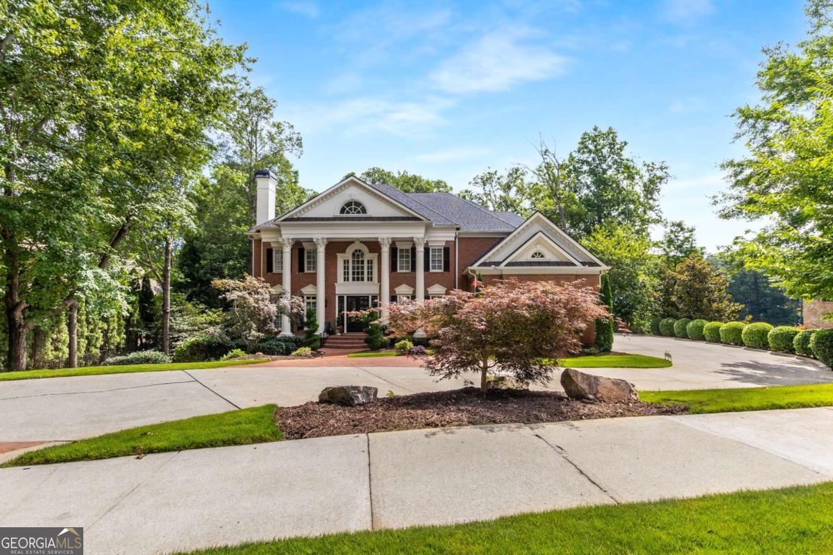 Step into timeless sophistication and grand-scale living in this exquisite European-style estate, nestled within the exclusive gated enclave of Sugarloaf Country Club. Boasting 9,247 square feet of expansive space-including over 6,100 square feet above ground-this five-bedroom, five full and two half-bath residence combines architectural grace with enduring quality. A stately two-story foyer introduces the home with sweeping European-inspired dual staircases, intricate crown molding, and rich hardwood floors that flow throughout. Designed for both refined entertaining and intimate everyday living, the expansive layout features a main-level guest suite with private bath, multiple living areas, and five fireplaces-including in the formal living room, executive office, and the sumptuous owner's suite. At the heart of the home, a chef's kitchen showcases custom cherry cabinetry, stone countertops, stone flooring, and top-of-the-line appliances. A generous eat-in breakfast area opens to a warm keeping room, while the formal dining room easily accommodates a large table-perfect for hosting elegant dinner parties. The handsome office exudes professionalism with cherry wood built-ins and a stately ambiance. The owner's suite is a retreat in itself-offering a private sitting area, fireplace, spa-like bath with soaking tub and oversized shower, dual vanities, and a roomy walk-in closet. Each secondary bedroom features its own en-suite bath, ensuring comfort and privacy for all. The walk-out terrace level-currently unfinished-offers 3,261 square feet of untapped potential with golf course views and direct outdoor access. A three-car garage, spacious laundry/mudroom with sink, 2023 roof, and whole-house water filtration system round out the thoughtful, high-end features of this estate. Situated on a private, beautifully landscaped lot, this residence offers the perfect blend of serenity and luxury. Sugarloaf Country Club provides optional access to TPC Sugarloaf with world-class golf, a resort-style Lifestyle Center featuring fitness, tennis, swimming, and exclusive clubhouse dining.