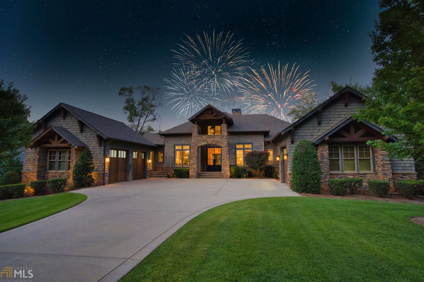 Relax, unwind and escape to your own private lakefront resort in Reynolds Lake Oconee! Intricate attention to detail and stunning architectural features are showcased throughout the numerous rooms and entertaining spaces making this property the quintessential lake house for families that love to entertain. The spacious master suite boasts a double-sided fireplace,panoramic lake views and unsurpassed luxury in the master bath. The exquisite chef's kitchen is open to many dining and sitting areas and is appointed with custom cabinetry, commercial grade high end appliances, quartz countertops, custom vent hood and multiple islands and bars. Terrace level is home to additional guest suites, bunk room, theatre, tasting room, wine cellar, billiards, an additional full kitchen with pass through windows, secondary laundry and storage. Outside you'll find endless amenities including an infinity edge, saltwater pool with jet propulsion, stone hot tub, outdoor cabana with full kitchen, swim up bar, and a one of a kind waterfall coming from the roof. Screen porches with motorized vinyl panels, three outdoor fire-pits and extensive landscaping plus a max dock with 4 lifts. You will want for nothing and truly be living the dream at this extraordinary lakefront resort!