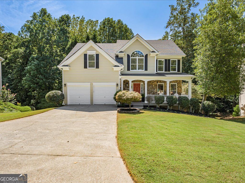 Johns Creek living made easy in Abbotts Pond, a welcoming swim/tennis neighborhood. This beautifully updated 5-bedroom, 3.5-bath home offers about 3,500 sq ft of light-filled space on a quiet cul-de-sac lot. From the charming front porch to the lush, private backyard, every area is set up for daily comfort and easy gatherings. Step inside to rich hardwood floors and an open layout that feels bright and connected. The oversized great room stands out with a floor-to-ceiling stacked-stone fireplace-an eye-catching centerpiece for movie nights or relaxed conversation. The renovated kitchen brings everyone together with crisp cabinetry, modern fixtures, premium appliances, and a large island with seating. A sunny breakfast area and a flexible dining/family room create simple flow, whether you're hosting friends or keeping it low-key. Upstairs, the spacious primary suite is a calm retreat with double vanities, a separate shower, and a soaking tub. Three additional bedrooms deliver real flexibility-use them for sleeping, a home office, fitness, crafts, or a quiet reading spot. A bonus area off one bedroom adds even more options. The finished terrace level is a standout. With its own private entrance, a comfortable bedroom, an updated full bath, a second fireplace, and a built-in coffee bar, this level works well as a guest suite, studio, or work space. An oversized unfinished storage room helps keep seasonal items and gear neatly tucked away. Outdoor living shines here, too. Enjoy morning coffee on the deck overlooking mature trees, then head to the lower patio for weekend cookouts or evening downtime. A small creek meanders along the back of the property, adding a peaceful, natural backdrop and an extra sense of privacy-perfect for unwinding at the end of the day. The backyard feels green and quiet, giving you a simple, relaxing escape. All of this comes with easy access to shopping, dining, parks, and everyday conveniences. The property is zoned to the highly regarded Chattahoochee High School. Thoughtful updates, flexible spaces, a serene Creekside setting, and a friendly neighborhood vibe make this home an easy yes-come see how well it fits your day-to-day.
