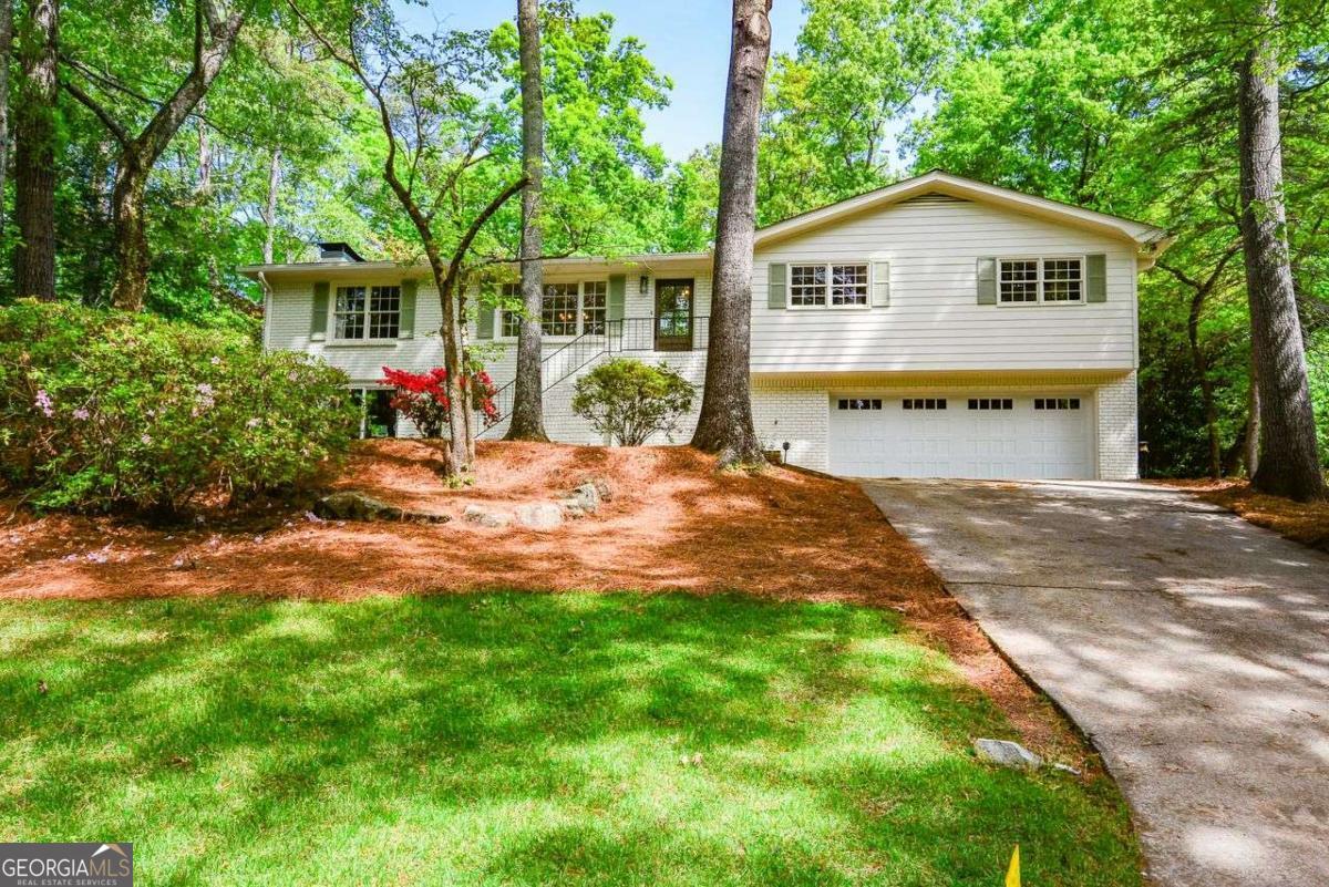 This three-bedroom, three-bathroom home encompasses approximately 2,126 square feet of living space nestled on a lot of approximately 11,600 square feet. The property has been thoughtfully renovated and updated throughout, offering a move-in ready condition. The home features a screened-in porch, providing a comfortable and protected outdoor living space for relaxation or entertaining. The large level backyard offers ample room for recreation and leisure activities. The three bedrooms, including the primary bedroom, provide comfortable and versatile living accommodations. The three bathrooms have been updated with modern fixtures and finishes, ensuring functionality and aesthetic appeal. The property is situated in an area with great schools, making it an ideal location for families or those prioritizing educational opportunities. The combination of the renovated interior, outdoor living spaces, and desirable neighborhood amenities creates a truly appealing living environment.