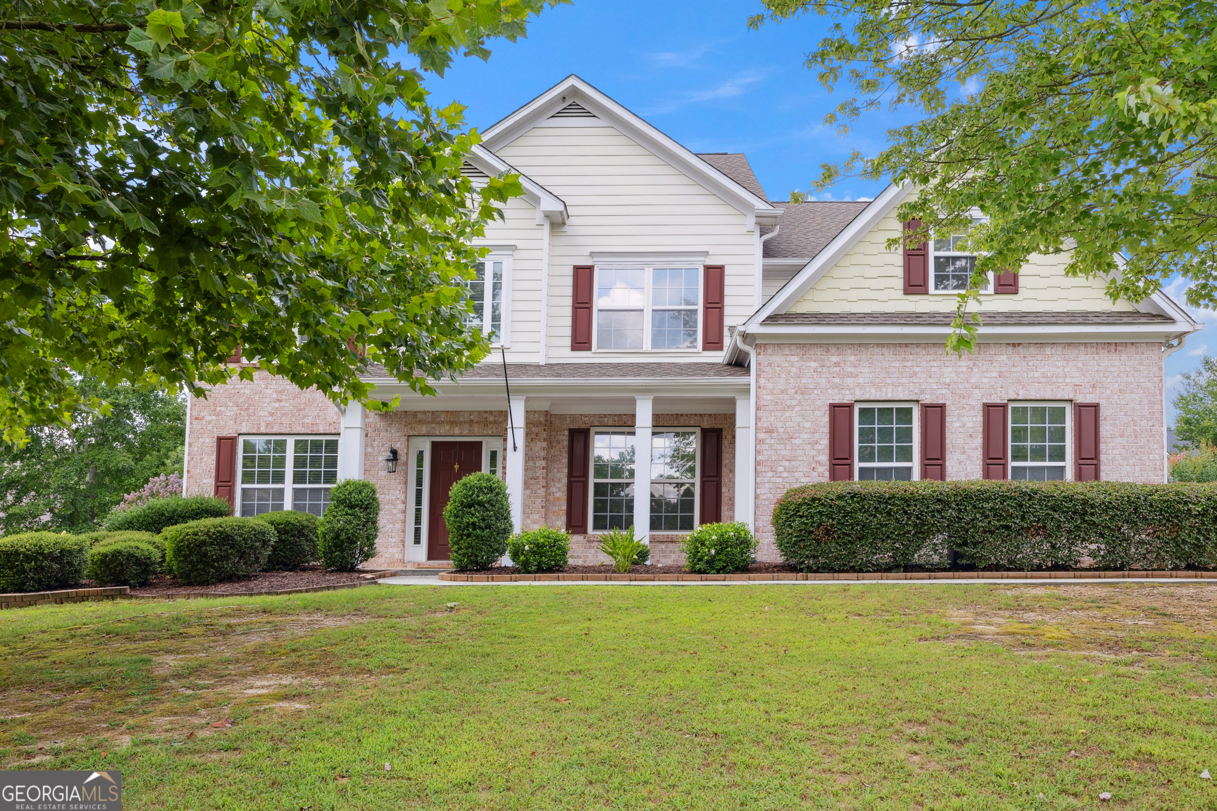Welcome to this timeless traditional beauty, ideally located in the highly sought-after Gwinnett County Schools Seckinger cluster. This thoughtfully maintained 4-bedroom, 2.5-bath home sits on a spacious, fenced lot and offers the perfect blend of comfort, functionality, and style. Step into a soaring two-story foyer that opens to a bright and inviting layout. To the right, a formal dining room is perfect for hosting, while to the left, a versatile space serves beautifully as a formal living room or sitting area. An additional main-level flex room adds even more functionality, ideal for a home office or study, and it can easily be converted into an additional bedroom. The light-filled, two-story great room features a cozy fireplace and views of the private backyard. The kitchen, designed for both everyday living and entertainment, opens to a serene screened-in porch perfect for morning coffee or relaxing evenings. Outside, the level backyard offers endless opportunities for entertaining, gardening, or even adding a pool. Upstairs, the expansive primary suite serves as a peaceful retreat with vaulted ceilings, a sitting area, and a spa-inspired ensuite featuring double vanities, a soaking tub, and a generous walk-in closet. Three additional bedrooms share a well-appointed full bath and provide ample space for family or guests. The Seneca Farms community includes amenities such as a pool, tennis courts, and pickleball all just minutes from I-85, the Mall of Georgia, Lake Lanier, and some of the area's best shopping, dining and parks. More than just a home, this is a lifestyle. Come experience it for yourself and make this beautiful property yours today.
