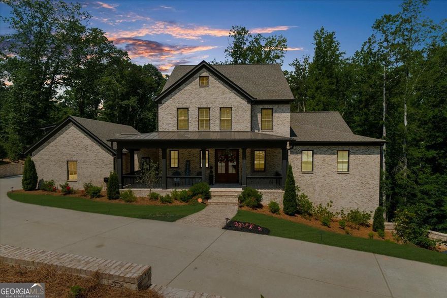 Welcome to Your Dream Home - Where Luxury, Design, and Comfort Converge Tucked away on a serene and private 1.2-acre lot in the sought-after Andersen Farm community, this exceptional custom residence-completed in 2022-offers a flawless fusion of sophisticated finishes, thoughtful functionality, and timeless elegance. Every element of this home was curated with purpose and precision to create a living experience that is as elegant as it is effortless. From the moment you step onto the inviting front porch, you're greeted with timeless architectural detail and a sense of calm that continues throughout the home. At its heart lies a chef's kitchen designed to impress and perform, featuring premium Thermador appliances, striking quartz countertops, a walk-in pantry, pot filler, oversized island, and a sleek butler's pantry-ideal for entertaining or everyday indulgence. The kitchen flows seamlessly into a sun-drenched great room with wood-beamed ceilings, a stunning fireplace, and walls of windows that bring the outdoors in-creating a space equally suited for intimate gatherings or lively celebrations. The main-level primary suite is a private sanctuary, complete with its own laundry area, a luxurious spa-inspired bath with a soaking tub, oversized walk-in shower, dual vanities, and an enviable custom closet with tailored storage solutions. Upstairs, you'll find three spacious secondary bedrooms-each with its own en suite bath-and a second laundry room for added convenience. No detail was overlooked. The fully finished terrace level is an entertainer's dream, featuring a custom bar with dishwasher and mini fridge, a spacious media and lounge area, a private guest suite, full bath, and a dedicated home gym-offering flexibility for hosting, relaxing, or recharging. Additional features include a three-car garage on the main level, an oversized mudroom that connects to a partially fenced backyard, and a thoughtfully placed dog washing station-perfect for pet lovers. Unwind year-round on the charming screened-in porch overlooking the tranquil wooded backdrop-your own personal retreat. All of this, just minutes from the natural beauty of Kennesaw Mountain, award-winning healthcare at Kennestone Hospital, and the vibrant shops and dining of historic Marietta Square-less than a mile away. Quick access to major interstates ensures convenience without compromise. This home embodies the best of West Cobb living: luxury, comfort, privacy, and proximity. Discover the rare opportunity to own a home that not only meets your needs-but exceeds your dreams.