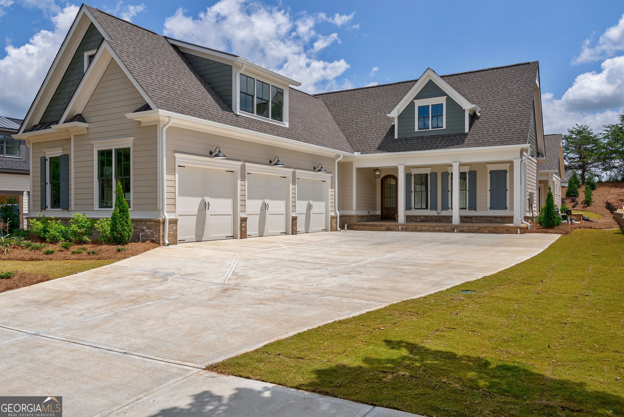 NEW CONSTRUCTION in THE GEORGIA CLUB! Dont miss this fabulous newly constructed courtyard home in Oconee Springs! 1250 Greenleffe Dr boasts 6 beds, 6.5 baths, wrapped around a captivating courtyard complete w/ state-of-the-art pool & spa. The main floor of the home was thoughtfully designed to combine 3 bedrooms each w/ private baths & open concept public spaces hosting a spectacular kitchen, spacious dining room, & dramatic great room. The gourmet kitchen boasts custom cabinets w/ handcrafted hardware, designer curated, leathered quartzite tops, & tile. An artisan crafted vent hood adorned w/ champagne gold trim draws your eyes to the 48 Thermador gas range & polished nickel Kohler Artifacts pot filler. The paneled 30 freezer & refrigerator columns adjacent to the 5 by 9 ft island w/ farm sink. Designer curated lighting illuminate this space. The kitchen also features a working pantry w/ tailored cabinetry, a drawer microwave, & quartz tops. A butlers pantry w/ custom cabinetry, handcrafted hardware, quartzite tops, & a fabulous mosaic tile back splash hold a beverage center & built-in ice maker. Adjacent to the kitchen is a well-sized dining area that opens to the great room. The great room boasts 14-ft vaulted, tongue & groove ceilings w/ wooden beams & a floor to ceiling painted brick fireplace w/ gas logs & designer curated mantle. Off the great room is a covered patio overlooking the private backyard. The main floor is served by a stunning powder room, featuring a tiled wall, porcelain vessel sink w/ wall-mounted faucet, designer curated mirror, & specialty lighting. The spacious primary bedroom has French doors that open to a private patio overlooking the pool. The primary bath features marble tile, custom cabinetry & hardware w/ quartz tops & designer curated mirrors & lighting. It is complete w/ a zero-entry walk-in shower w/ frameless door, & a freestanding tub. The primary closet connects to the laundry & is finished w/ his & her custom closet systems. The 2nd main floor bedroom located off the back hallway boasts its own ensuite bath w/ zero entry shower, & walk-in closet w/ custom closet system. It is perfect for guests or a home office. The 3rd main floor bedroom is a detached suite. French doors lead into bedroom w/ views of the pool. The ensuite bath w/ direct pool access boasts a zero-entry shower & a frameless door. The upstairs hosts 3 bedrooms, each boasting its own ensuite bath and walk in closet w/ custom closet system. An enormous loft area presents endless possibilities & an upstairs laundry room adds convenience. Additionally, over 500 sq ft of walk-out attic storage provides ample room for all the things. 1250 Greenleffe Dr was designed to give maximum views into the private courtyard, the crown jewel of this home. The raised stack stone spa spills over into the heated pool. The center sun shelf provides a cool place to lounge. State-of-the-art Omni-Logic technology controlled easily by an app on any smart device & a salt system ensures effortless maintenance. 16-ft sliders connect over 1000 sq ft of superior outdoor living space seamlessly w/ the interior of the home. The space has been prewired for outdoor entertainment & a gas line for easy connection to any outdoor kitchen. Completing the home is an oversized 3-car garage, ensuring ample space for parking & storage. The space has been prewired for an electric car. The garage also houses a closet containing 2 tankless water heaters. Zoned for Dove Creek Elem, Dove Creek MS, & N. Oconee HS The Georgia Club is a gated community w/ a private golf & country club that includes 27 holes of championship golf, aquatic center, fitness center, tennis & pickle ball, on site restaurant, & more. New memberships are only available to residents of the community. The Georgia Club is a fabulous community that offers a lifestyle unlike any other ... you know you are home when you drive through the gates!