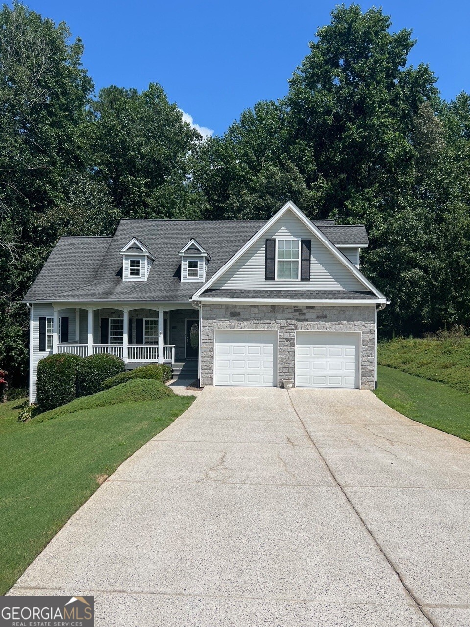 Welcome home to this beautifully maintained 3-bedroom, 2-bathroom ranch situated on a spacious 0.75-acre lot in a quiet, established neighborhood. Tucked away in a cul-de-sac, this home offers privacy, tranquility, and a layout perfect for both everyday living and entertaining. Step inside to find a bright, open floor plan with soaring ceilings and gleaming hardwood floors throughout the main living areas. The kitchen features ample cabinetry, generous counter space, and a cozy eat-in area, complemented by an open concept dining room. A large bonus room upstairs adds flexible space for a playroom, media room, or home office. The spacious primary suite includes a flex space perfect for a sitting area or office, a large walk-in closet, and an en suite bath with a double vanity, separate shower, and soaking tub. Two additional bedrooms are well-sized and share a full hall bath. Enjoy year-round outdoor living on the screened-in back porch overlooking a beautiful backyard. A large deck provides even more room for entertaining friends and family. The unfinished basement offers plumbing for an additional bathroom, abundant storage and endless possibilities, create a home theater, gym, craft room, or customize it to fit your family's needs. Conveniently located near GA 400, Lake Lanier, and the North Georgia mountains, this home truly has it all. Don't miss your opportunity to own this move-in ready gem in a prime location! Professional photos coming soon.