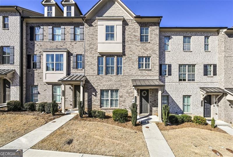 Welcome to 4362 White Spruce Alley, a beautifully updated 4-bedroom, 3.5-bathroom townhome nestled in the sought-after Carver Hills community of Doraville, Georgia. This residence has been thoughtfully refreshed with new paint and brand-new carpeting throughout, providing a pristine and inviting atmosphere for its new owners. The townhome features an open-concept design that seamlessly connects the living, dining, and kitchen areas, creating an ideal space for both daily living and entertaining. The well-appointed kitchen boasts contemporary cabinetry and stainless steel appliances, catering to culinary enthusiasts. Each of the four generously sized bedrooms offers a comfortable retreat, with the master suite featuring a private en-suite bathroom for added convenience. This revitalizing community features a mix of townhomes and single-family homes, all designed with contemporary aesthetics and functionality in mind. Residents can enjoy a secure environment with gated access, as well as recreational facilities including a swimming pool, clubhouse, tot lot, bike repair stand, and a community park equipped with lounge chairs and a fire pit. The neighborhood is adorned with biking and walking trails, providing ample opportunities for outdoor activities and relaxation. Situated near Peachtree Industrial Boulevard and I-285, the community is close to local shopping and dining options, including The Forum on Peachtree Parkway, Perimeter Mall, and Midtown, ensuring residents have a variety of amenities at their doorstep. Don't miss the opportunity to make it your new home!