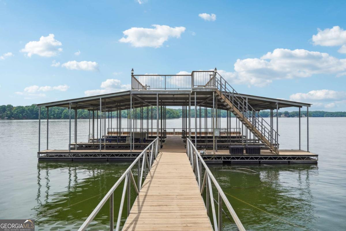 Bring your choice of builder and start your dream lake retreat in one of the well established lake neighborhoods. 3.6 Acre Deep-Water Lot In A Very Private Luxury gated Community with the luxury properties on Lake Lanier. 265 FT Of Corp/Waterfront Footage, All City Utilities available , Covered Six Slip Community Dock With Party Deck On Top. There is an easy walking path to the dock. 1 Dock Slip Included In Sale. Total of 3 Lots Available, From 2-6 +/- Acre Each, 1 Dock Slip Included With Each Lot. Quick and easy interstate access and located only 5 minutes from the shops and restaurants in downtown Gainesville.