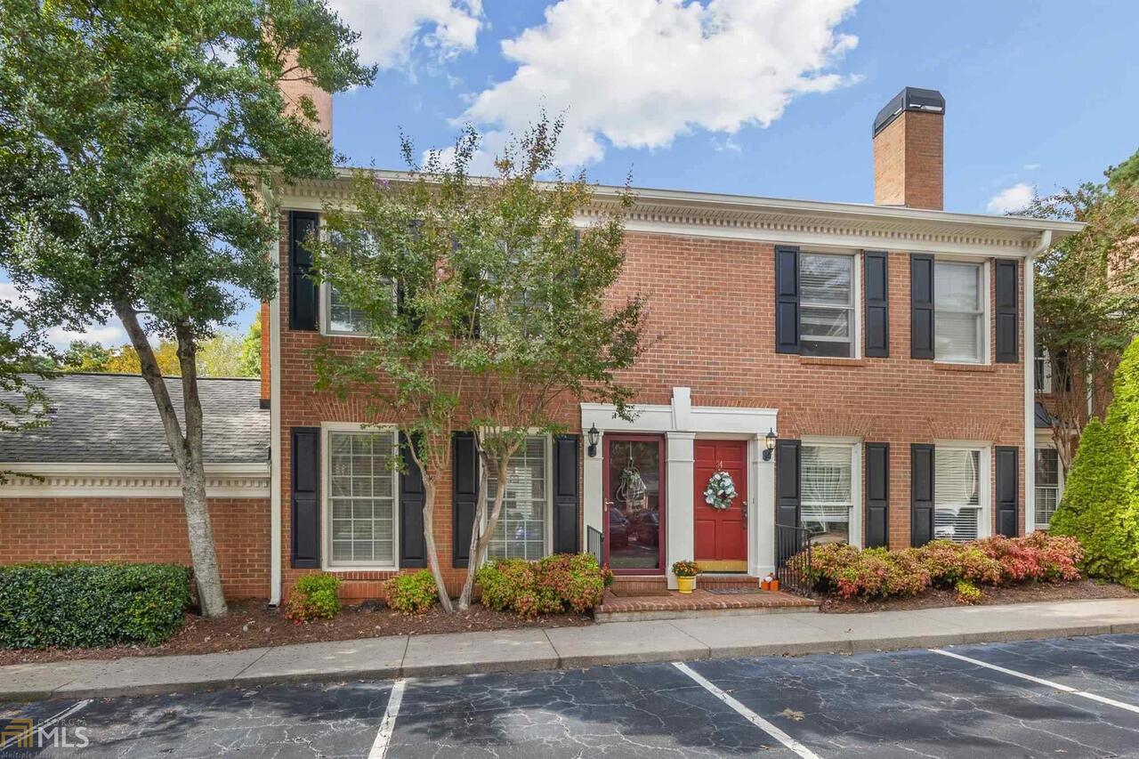 Don't miss out on this COMPLETELY RENOVATED End Unit Townhome in the heart of Sandy Springs/Dunwoody!! CUTE AS CAN BE! One of the few with OVERSIZED ATTACHED 2 CAR GARAGE (No drive under)!! GORGEOUS UPDATED KITCHEN includes all appliances with gas range and refrigerator!! Beautiful tile backsplash, QUARTZ counter tops, built in wine rack, soft close cabinets and new tile floors with Solarium windows that let the sunshine in!! Hardwoods on the main level, upstairs hall and Master Suite which includes a updated bath with subway tile, jetted tub and quartz counter tops. Guest Suite with updated bath that features a beautiful tile floor. This home also features NEW HVAC, WATER HEATER, GARAGE DOOR AND OPENER, RING DOORBELL, NEST THERMOSTAT AND ALL NEW LIGHTING!! Nothing to do on this home except enjoy the private fenced patio and community amenities including pool, tennis, clubhouse, gated dog park, playground, and private pond to relax by. Or garden in the new community garden and enjoy some fresh veggies! Feel secure in this GATED community near some of the best shopping, dining and entertainment in town! Great Schools are nearby as well! Easy access to GA 400 and I-285. Come see this SWEET HOME and make it yours before it's gone!! HOA fees include: Swim/Tennis, Clubhouse, Dog Park, Common Area Maintenance, Insurance, Exterior Maintenance, Reserve Fund, Water and Trash...What value!
