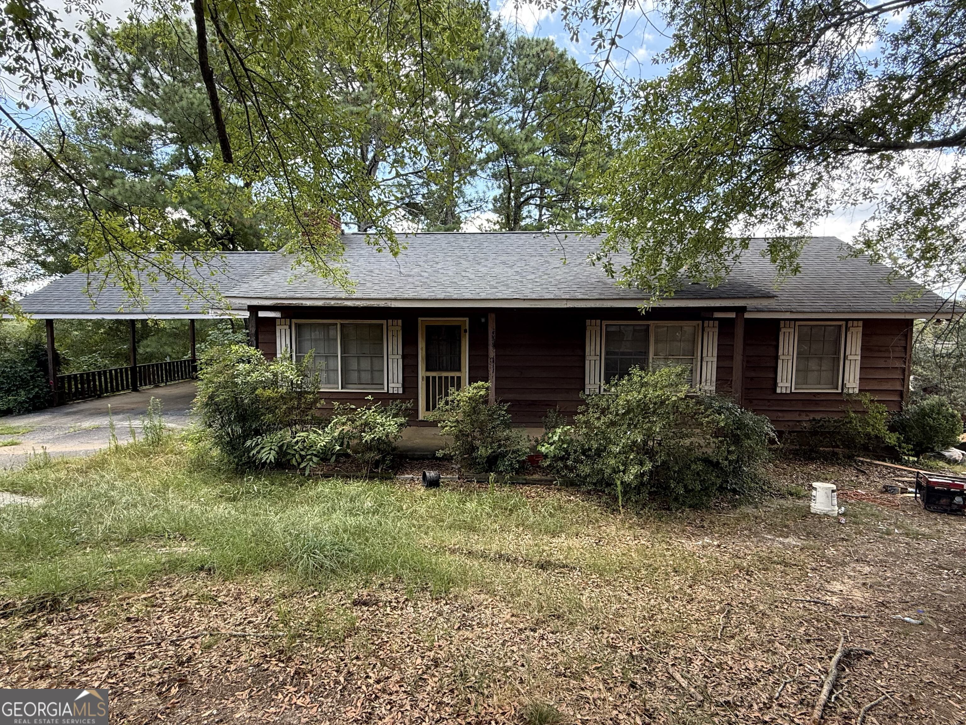 Rare Opportunity in Buford City Schools ? No HOA & Ideal for Redevelopment! Welcome to 3273 N Bogan Rd, a charming 3-bedroom, 2-bathroom single-family home nestled on a beautifully secluded 0.724-acre lot in the highly sought-after Buford City School District. Built in 1975 and offering 1,306 square feet of living space, this home presents endless potential. Whether you're looking to renovate, expand, or redevelop the property altogether. Surrounded by mature trees and tucked away from the road, the lot offers the perfect blend of privacy and convenience. Located just minutes from the Mall of Georgia, Lake Lanier, parks, dining, and with easy access to major interstates, this location is unbeatable. With no HOA restrictions, the possibilities are wide open. whether you're a homeowner, builder, or investor looking for your next project in one of Gwinnett County's most desirable areas. Don't miss this incredible opportunity to own a spacious lot with development potential in the heart of Buford! Second lot available next door.