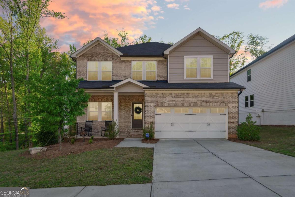 Perfect home to lease....everything you could want! This stunning 4-bedroom, 2.5-bath single-family home perfectly combines timeless style with everyday comfort. Located in a welcoming and desirable community, this immaculate and well maintained home offers thoughtful design, quality finishes, and all the space you need to live, work, and relax. From the moment you arrive, the charming front porch invites you to sit back, unwind, and feel right at home. With a brick-front exterior, the home boasts both curb appeal and long-lasting durability. Step inside to an open and airy floor plan filled with loads of natural light. The heart of this home is the chef-inspired kitchen, complete with stone countertops, a large island, walk-in pantry, and high-end ENERGY STAR appliances-including a gas range, microwave, dishwasher, and tankless water heater. Loads of storage and workspace makes this the perfect spot to create a gourmet meal or entertain friends and family,a space to bring family together. Open views into the spacious family room with its beautiful gas fireplace, promises the perfect setup for casual gatherings or family nights ....giving the word cozy a whole new meaning! There's also a separate formal living area that can easily be used as a home office, dining room, or creative space to fit your lifestyle. Upstairs, you'll find a flexible loft area that can serve as a media room, reading nook, or play space. The luxurious Master is a true retreat, featuring a spa-like bathroom with soaking tub, custom tile shower, double vanity, and a generous walk-in closet. Three additional bedrooms, a second full bath, and a convenient upstairs laundry room complete this spacious second floor. All this sits on a full unfinished basement stubbed for a bath and with its own exterior entrance-offering endless potential for additional living space, a home gym, guest suite, or an amazing entertainment zone. Step outside to enjoy a freshly stained back deck that backs up to serene woods, creating a peaceful backdrop for relaxing evenings or quiet coffee in the mornings. Additional perks include a spacious 2-car garage, minimalist landscaping for easy upkeep, and a community loaded with amenities. Take advantage of the clubhouse, sparkling pool, playground, sidewalks, street lighting, and a dog park for your furry friends. All of this is just minutes from the Outlet Mall, schools, shopping, dining, and everything else your family needs or wants. This home easily checks all the boxes-style, space, comfort, and convenience, what else could you want?