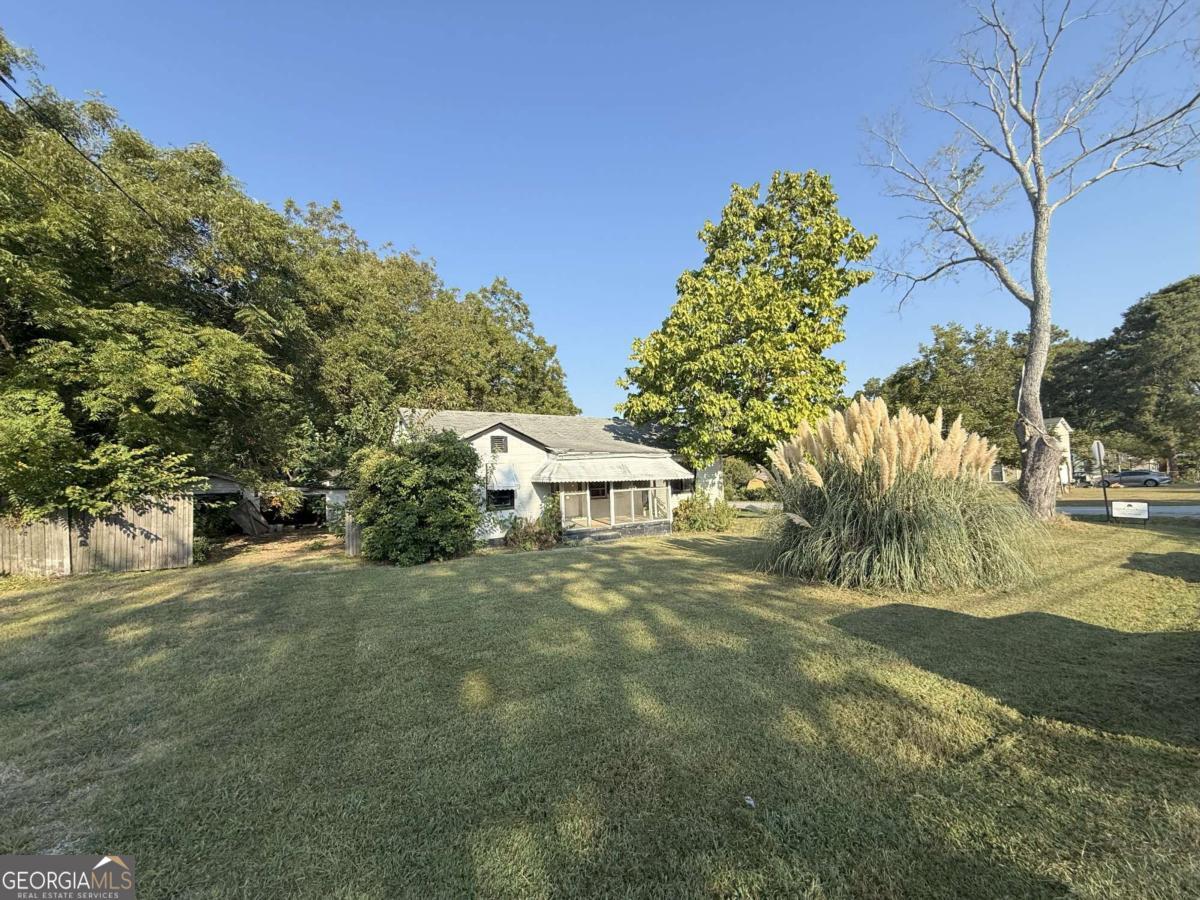 INVESTOR SPECIAL!! Come and get it! 1948 Benson Avenue SE - 3 bed, 2 bath, 1,336 sq ft on a quarter-acre lot. Built in 1950, this ranch-style home offers solid bones, a detached garage, a level lot and tons of potential. Whether you're flipping, renting, or renovating, this property is priced to move and ready for your vision.