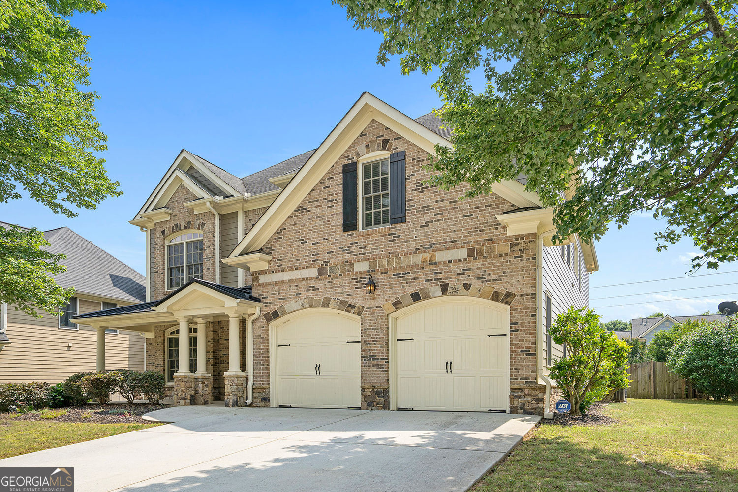 Tucked into the heart of Smyrna's highly desirable Barnes Mill community, 585 Lawton Bridge Rd is a beautifully maintained, move-in ready home that offers the ideal blend of space, thoughtful design, and everyday livability. This spacious 4-bedroom, 3-bathroom home is designed with flexibility in mind, offering multiple living areas and quality finishes that create an inviting and practical space for today's lifestyle. Even better, the sellers are offering a $5,000 buyer incentive to use however you choose-whether it's a rate buydown, closing costs or upgrades. It's added value and flexibility to help make this home your own. From the moment you walk in, you're welcomed by a light-filled atmosphere and a layout that feels open yet purposeful. Off the entry is a generously sized guest suite with a full bathroom-perfect for out-of-town visitors, in-laws, or a quiet home office. This feature alone makes the home ideal for multigenerational living or the modern work-from-home lifestyle. The heart of the home is the soaring two-story great room. Bathed in natural light from oversized windows and accented with beautiful molding and a cozy fireplace, it's a stunning space that manages to feel both grand and warm. Whether you're hosting a gathering or enjoying a quiet evening, this room sets the tone for comfort and connection. The kitchen is a true centerpiece-both stylish and functional. With granite countertops, rich cabinetry offering ample storage, and an oversized center island, it's designed for everything from daily meal prep to weekend entertaining. The sunny breakfast nook is the perfect place to start your day, while the formal dining room just off the living area provides a more traditional space for holidays, dinner parties, or family meals. Upstairs, the home continues to impress with a spacious loft that adds a bonus flex space-ideal as a media room, home gym, playroom, or second office. The options are endless, and the space easily adapts to your needs. The oversized primary suite is a true retreat, complete with tray ceilings, a large sitting area, and spa-inspired en suite bathroom. Enjoy dual vanities, a soaking tub, a separate walk-in shower, and a spacious walk-in closet with room to spare. The two additional upstairs bedrooms are equally inviting and connected by a well-appointed Jack-and-Jill bathroom, creating an ideal setup for kids or guests. Step outside and you'll find your own private oasis. The covered back patio is perfect for relaxing with a book, entertaining guests, or firing up the grill. The fenced backyard offers privacy and space for pets, kids, gardening, or creating that dream fire pit lounge area you've always wanted. Life at Barnes Mill offers more than just a beautiful home. This vibrant swim and tennis community features scenic walking trails, a clubhouse, playground, and direct access to the Silver Comet Trail. You'll enjoy the convenience of being just minutes from The Battery, Truist Park, Smyrna Market Village, I-285, and all the dining, shopping, and entertainment options that make this area so special. Whether you're looking for more room to grow, a home with dedicated work-from-home options, or a layout that works for a variety of lifestyles, 585 Lawton Bridge Rd delivers. It's not just a house-it's a place you'll love coming home to. Schedule your private showing today and discover what makes this home truly stand out.