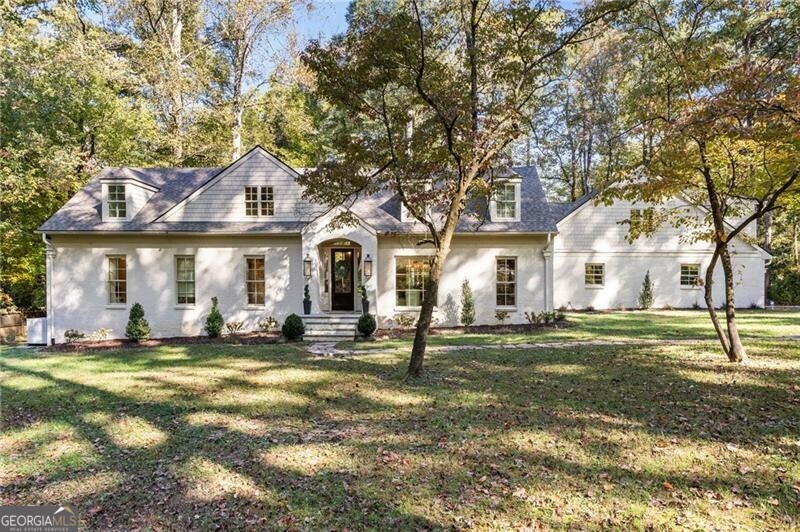 Amazing opportunity for a sleek, beautifully renovated and expanded home at the end of a cul-de-sac on over an acre of land. Perfectly located just seconds from area private schools, Heards Ferry/Riverwood school district. Gorgeous kitchen with large Taj Mahal quartz island, view to family room. Expansive covered back deck with built in grill and outdoor kitchen, wood burning fireplace, view to flat back yard. Primary suite on main with walk in closet, marble bath. Guest room on main. Upstairs has been recently finished and has a large bonus room and secondary living space plus 3 bedrooms. New driveway, newer roof, home taken down to the studs. Smart home AV system and white oak hardwoods throughout. Truly a perfect 10!
