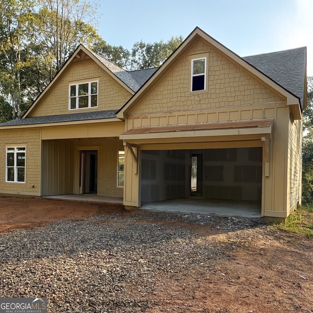 Welcome to 2145 Hwy 9 S! Currently under active construction on 1.8 private acres, this new craftsman home is designed to feel both inviting and inspiring. Imagine gathering in the sunlit kitchen with marble counters, custom cabinets, and a spacious island at the center of it all. Picture starting your mornings in the main-level owner's suite with a spa-style bath, or creating a home theater, gym, or game room in the full daylight basement. Evenings can be spent on the covered back porch surrounded by your wooded yard, and weekends exploring nearby gems like Kaya and Etowah wineries, Amicalola Falls, and the scenic Dawson Forest trails. Every detail of this home invites you to settle in and make it your own. ** PLEASE READ: If using google maps use address 2211 GA-9, Dawsonville. If using Apple Maps use address 2211 SR-9, Dawsonville. Home has for sale banners and red for sale sign with agent info. 2145 will be the last home on the black top driveway.