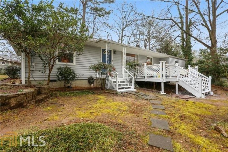 Precious and renovated in the coveted Brookhaven neighborhood of Ashford Park! Enter into the HGTV worthy sitting room with shiplap walls and a wood burning stove (this room makes an incredible home office!), fully renovated Kitchen with white quartz counters, white cabinets and stainless appliances. Sunny and spacious Living and Dining Room have plenty of space to relax or entertain. Three great size bedrooms, each with professionally built-out closets. Fantastic bathroom with swoon worthy fixtures and great linen closet offers wonderful storage! Large deck overlooks the half acre lot with plenty of play space. Easy walk to all the shops and restaurants of Village Place Brookhaven and Ashford Park Playground/Tennis Courts! Private back drive offers a hard to find cul-de-sac with no traffic. 4 parking spots!
