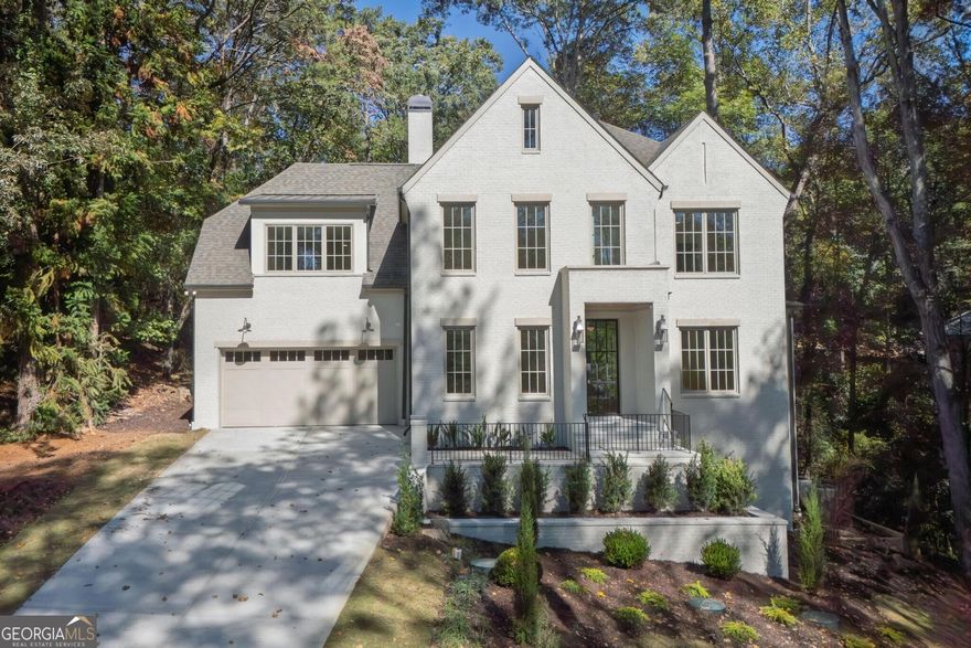 Stunning New Construction in Buckhead Built by SouthCrest Homes perfectly set on Cloudland Drive and surrounded by mature hardwoods, this new home offers a rare combination of privacy, convenience, and timeless design. With close proximity to outstanding private and public schools, as well as shops and restaurants, opportunities for new construction in this location are nearly impossible to find.  A gracious foyer opens to beautifully curated interiors by Bellweather Interiors. The first-floor primary suite features a spacious bedroom, a luxurious bathroom, and incredible his-and-hers closets. Upstairs, four large bedrooms and a versatile media/study room create a layout that is both unique and highly functional-designed to live and flow effortlessly.  At the heart of the home, the chef's kitchen showcases premium appliances, an oversized island, and expansive windows overlooking a private wooded backdrop. The open family room extends seamlessly to a covered porch with fireplace, offering year-round indoor-outdoor living.  This property blends elegance, livability, and a rare wooded setting-an extraordinary find in Buckhead.