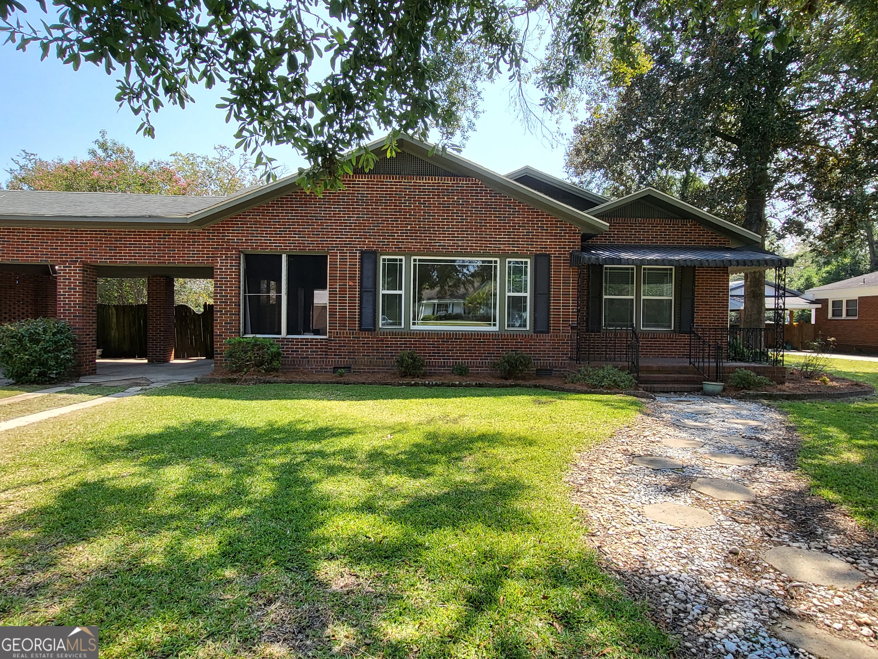 This 3-bedroom, 2-bath home is full of timeless character and classic details, offering the perfect blend of old charm and everyday convenience. Nestled in the heart of Brooklet, you can walk to local shops and restaurants. Inside, the home features spacious living areas, three large bedrooms, plus a versatile flex space-ideal for a gym, playroom, or guest space. There is also separate space for a home office or small business that has exterior access. Step outside to relax on the screened-in porch that is just over 200 sqft, perfect for enjoying morning coffee or evening breezes without the bugs. Or go out back in the large fenced yard, providing plenty of room for pets, gardening, or backyard gatherings and the outdoor workshop has limitless possibilities. If you've been dreaming of a home with personality, warmth, and room to grow, this one is a must-see!