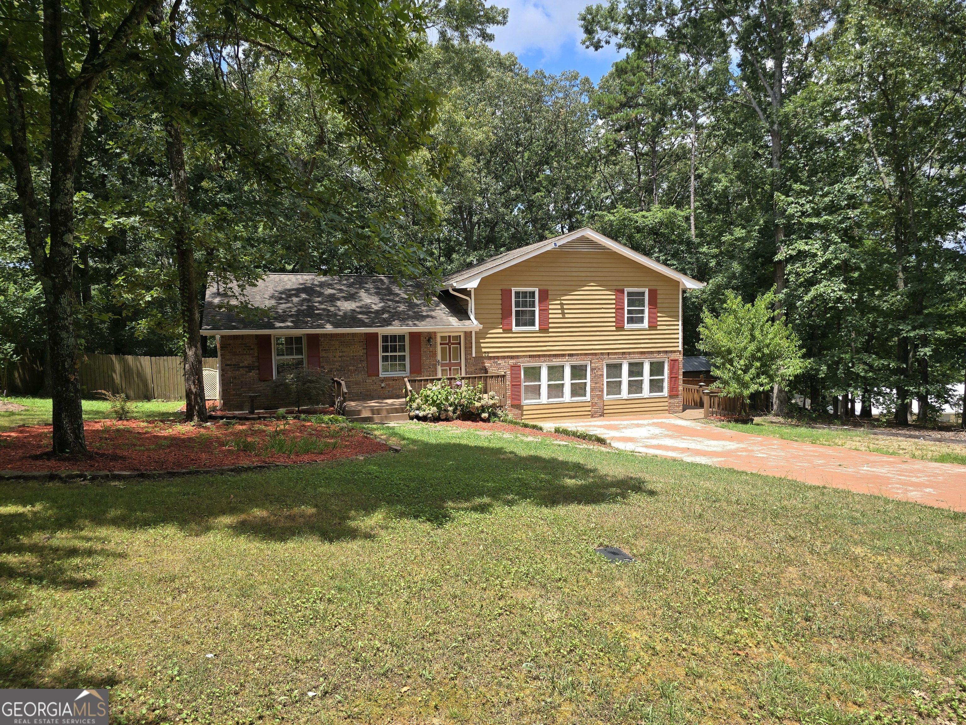 Well-maintained 3 bedroom/2.5 bath 4 sided brick home with huge wood burning fireplace , Red Oak & Maple hardwood floors, full finished lower level with laundry and 1/2 bath. Multi level enlarged decks and covered porch. Fully fenced back yard with lots of room for children and pets to play. 2 separate storage sheds. Easy drive to downtown Cartersville.