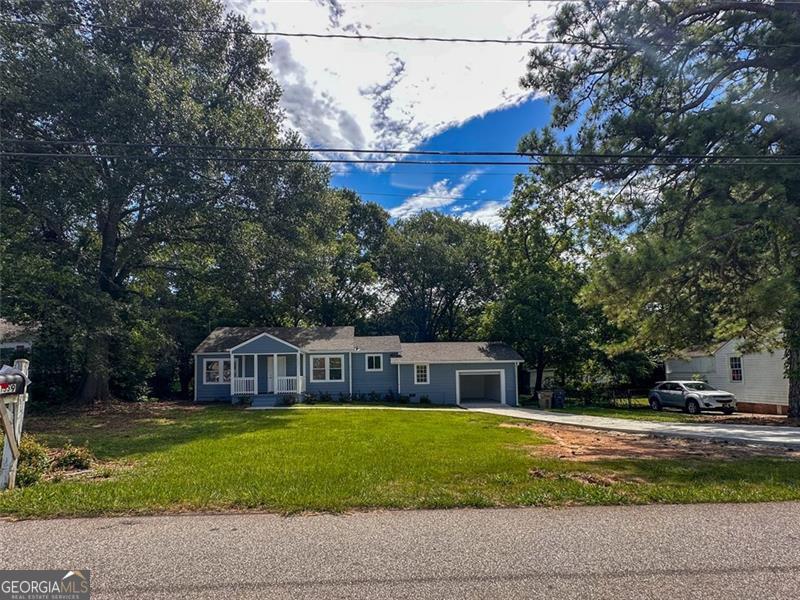 Welcome to this beautifully renovated 3-bedroom, 3-bathroom home located at 1539 Joyner Ave SE in Marietta. Situated on a 0.3-acre lot, this move-in-ready property features two primary-style suites, each with a private full bathroom, plus a third guest bedroom and an additional full bath. Enjoy a modern kitchen with brand-new granite countertops, stainless steel appliances, and updated lighting fixtures. The entire home has been upgraded with new flooring, new plumbing, new water heater, and updated electrical throughout. The property includes a converted small detached storage that can be used as a single-car garage perfect to fit small cars (Ex: Civic, small sedan size) with a new power-operated garage door and a back entrance leading to the laundry/mudroom. A brand-new concrete driveway and front walkway provide excellent curb appeal. Conveniently located near major educational institutions and local amenities: 0.2 miles to Pearson Middle School 0.9 miles to Green Acres Elementary 1.0 mile to Fair Oaks Elementary 2.0 miles to Osborne High School 7-minute drive to Chattahoochee Technical College 15-minute drive to Kennesaw State University (Marietta campus) Close to I-75, local parks, shopping, and dining All major systems and surfaces have been updated, making this home an excellent opportunity for buyers seeking a turnkey property in a well-connected Marietta location.
