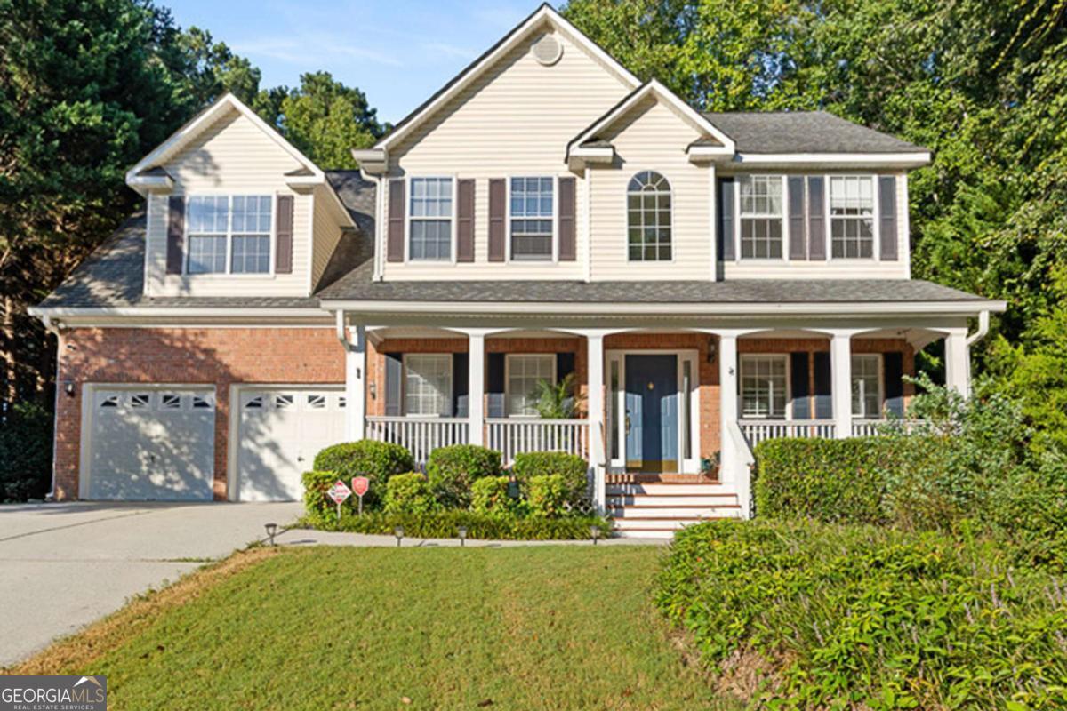 Welcome to this picture-perfect 2-story traditional home nestled on 1.37 acres, where timeless charm and everyday comfort come together in the most inviting way. A classic rocking chair front porch sets the stage for relaxed mornings and cozy evenings, while inside you're greeted with spacious living that includes 4 bedrooms, 2.5 baths, and both a formal dining room and formal living room designed for gathering with family and friends. At the heart of the home, the welcoming family room with its fireplace flows into the cheerful eat-in kitchen, beautifully appointed with white cabinetry, granite countertops, a breakfast bar, and a sunlit breakfast nook with a built-in desk that makes the space as functional as it is charming. Upstairs, the oversized owner's retreat feels like a true getaway with its tray ceiling, private sitting area, and spa-like bath featuring dual vanities, a soaking tub, and a separate shower. Secondary bedrooms are comfortably sized, offering flexibility for family, guests, or hobbies. The partial basement adds even more versatility with flex space perfect for a playroom, office, or media room. Outdoors, a spacious deck overlooks your very own backyard oasis with a sparkling inground pool, creating the ideal setting for summer fun, weekend barbecues, and countless memories with loved ones.
