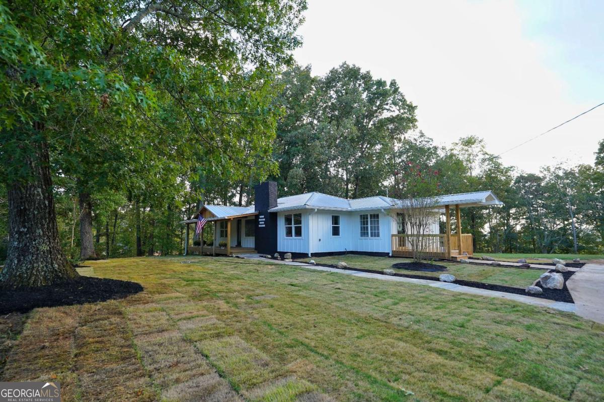 Country charm meets modern living! This fully renovated ranch on 1.55 acres offers privacy, space for a horse, and stylish updates throughout - all just minutes from Canton conveniences. Welcome to 1547 York Drive - a beautifully reimagined ranch home originally built in 1961, now completely transformed with modern updates while preserving its country charm. Nestled on 1.55 acres with no HOA, this property offers a rare blend of convenience and privacy. The backyard is partially fenced, spacious enough for a horse, and includes both an old barn and an additional storage building for all your outdoor needs. Recent upgrades include new exterior gutters, nearly new HVAC, brand-new windows and doors, granite countertops, and durable LVP flooring throughout. Both bathrooms have been fully renovated, with the primary suite featuring a luxurious zero-entry shower. The huge front porch, shaded by gorgeous old trees, is the perfect place to relax and take in the peaceful surroundings. Fresh sod in the front yard enhances the curb appeal, while the open layout inside creates a welcoming flow. Move-in ready, modernized, and sitting on a piece of land you'll be proud to call your own!
