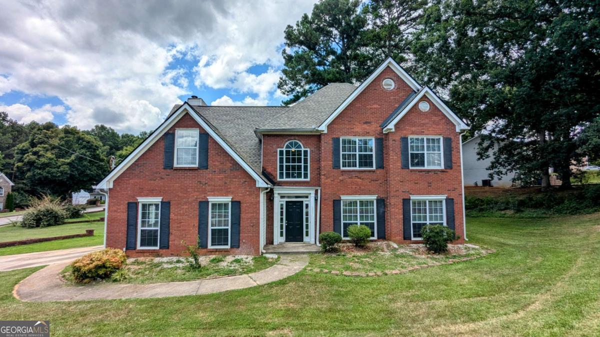 Welcome to this 4-bedroom, 2.5-bath brick-front home with classic curb appeal. The main level includes multiple living areas, a fireplace, and a bright sunroom surrounded by windows-perfect for relaxing or entertaining. The kitchen offers generous cabinet space, double ovens, and a view into the formal dining room. Upstairs, the oversized primary suite features tray ceilings, a walk-in closet, and an en-suite bath with a separate shower and soaking tub. Enjoy outdoor living on the brand-new back deck overlooking the yard. Agents: Please read private remarks/look at the offer guidelines in docs before calling, it should answer all questions you have.
