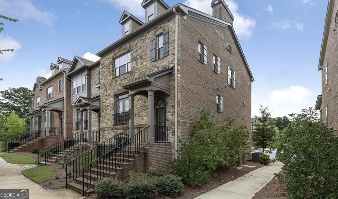 This could be your home! The ultimate downtown Alpharetta lifestyle awaits you in this beautiful, gated townhome community. Just steps from North Main and less than a mile from the heart of downtown, you'll enjoy access to top-tier dining, boutique shopping, the Alpha Loop trail system, and the excitement of Avalon. Inside, this 3-bedroom, 3.5-bath home is designed for both comfort and entertaining. The main level features a spacious living room, a convenient half bath, and an open-concept chef's kitchen with stainless steel appliances and plenty of counter space and storage. Step outside to the large, covered deck, ideal for hosting friends or simply relaxing with your favorite drink and a good book. Upstairs, the oversized primary suite is your private retreat with a luxurious ensuite bathroom featuring a double vanity, separate tub and shower, and a generous walk-in closet. A second large bedroom with its own ensuite bath completes the upper level. The first floor offers a third bedroom with a full bath, perfect for guests or a home office, along with a two-car garage and extra storage space. Don't miss this rare opportunity to live in one of Alpharetta's most sought-after locations.
