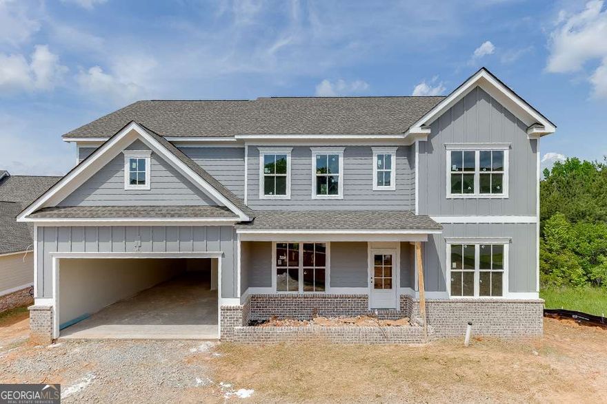 "LOT 159Q/JACKSON PLAN" Another impressive home in Traditions of Braselton by Hillgrove Homes! This floorplan boasts 5 bedrooms, 4 full baths and has all the designer touches. The spacious Gourmet Kitchen w/ oversized island overlooks the inviting Family Room. Coffered ceilings, shiplap, brick fireplace, cedar mantle and built-in cabinetry complete this space. The Kitchen features custom painted cabinetry w/ soft-close drawers, quartz or granite countertops, stainless steel appliances, tile backsplash, farm sink and spacious walk-in pantry. A Dining/Office/Flex Space and Study right off the Foyer boasts an extensive trim package. The oversized Primary Suite & Primary Bath add SO much space to this home and are complete with an oversized super shower and soaking tub, upgraded cabinetry and countertops, dual sinks and upgraded tile. Large secondary bedrooms (one full bed/bath on main level), closets & bathrooms are an extra perk. The covered back porch w/ fireplace is perfect for entertaining or back porch sitting! GOLF CART GARAGE! Sought-after Jackson County School System. Traditions of Braselton awards you swim/tennis/golf/restaurant/clubhouse/fitness facility and more. Endless activities for the amenity reach community seeker.