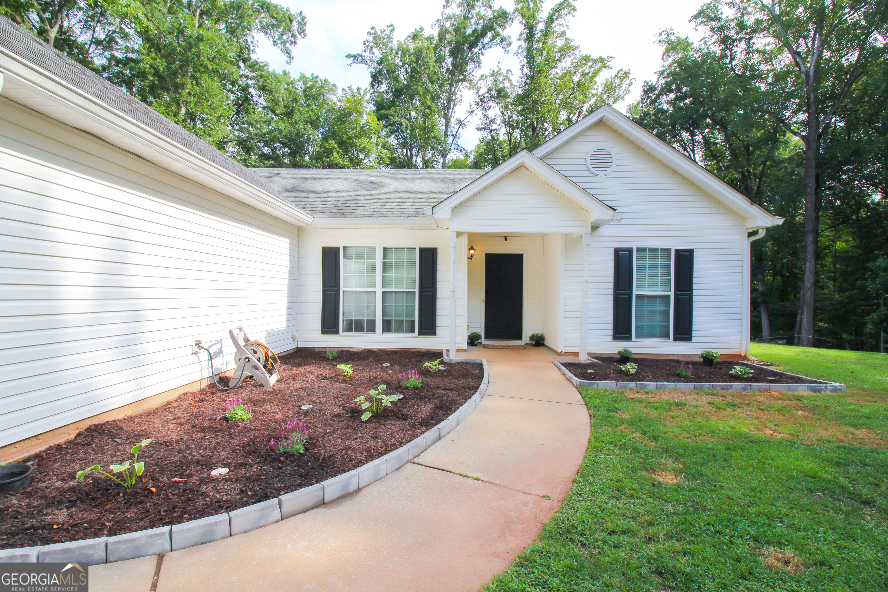 Welcome Home!!! Come and tour this Ranch style just off Hwy 316! Featuring Updated Vinyl flooring, Open family room with fireplace, Updated bathrooms, Separate dining Area, Bay window breakfast area looking out into the private cleared backyard. This house also features a Master bedroom with trey ceilings, and a master bath with tub and shower, walk-in closet. This house is in the USDA Eligibility Map. Close to shopping centers and Athens! Excellent country Home!!! Seller is motivated and ready to sell. Submit your offer!!!