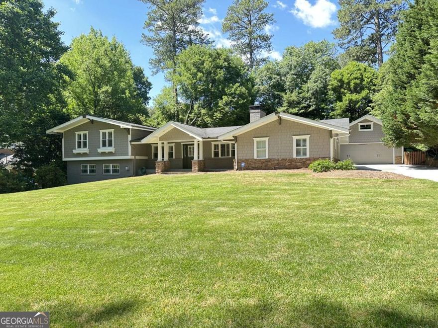 Exceptional opportunity to own a beautifully renovated home, on a quiet street in the highly sought after Oak Grove Elementary and Lakeside High School district. This comfortably chic home is designed for how people live, work, play today. This unique home seamlessly integrates functional spaces with a private outdoor oasis, creating the perfect backdrop for both everyday living and grand entertaining.  Step inside from the welcoming front porch and be greeted by an open airy great room with vaulted ceilings with an effortless flow to the heart of the home, a well-appointed kitchen with custom cabinetry and expansive island, perfect for entertaining. Step out to a beautiful patio, extending the living space outdoors to a private fenced backyard - an ideal setting for relaxing, al fresco dining and creating lasting memories for all ages.    Escape to the oversized primary suite, a sanctuary complete with a spa-inspired bath. Three additional bedrooms and three renovated baths provide ample space for everyone. The lower level features an expansive family room with a striking stone fireplace and real sandstone flooring, along with another potential bedroom, that can also be used as a private office - perfect for those that work from home. Conveniently located on this level is a laundry room and another half bath. Built in desks and murphy bed are amazing.    An actual detached oversized two-car plus garage that offers endless possibilities - cars protected from the elements with storage galore above. This oversize garage could easily be converted to a state-of-the-art home gym, an artist studio, or even an in-law suite....the possibilities are endless. You'll love the proximity to all the award-winning schools (both public and private), parks, playgrounds, pools and the new multi-use path. Phenomenally easy access to the Atlanta Airport, CHOA, Emory, CDC, I85, Buckhead, Midtown, and beyond.    Must See!
