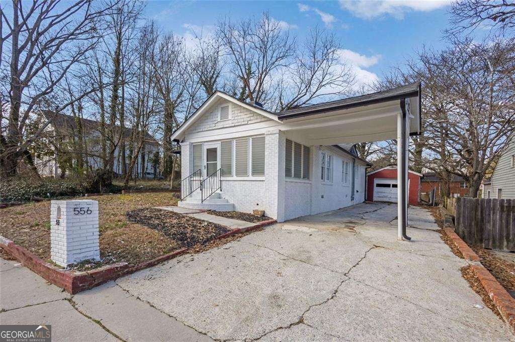 Step into timeless charm with this beautifully renovated 1940s four-sided brick home, ideally located just minutes from downtown Atlanta, Georgia Tech, Mercedes-Benz Stadium, the Georgia Aquarium, major interstates, and Atlanta Reservoir Park. This Section 8 approved property seamlessly blends classic character with modern updates, including a brand-new HVAC system, new water heater, a fully remodeled kitchen with sleek finishes, updated spa-like bathrooms, and a vapor-sealed crawlspace for added efficiency. The rare detached garage will be fully upgraded and repaired by closing, offering even more value and functionality in this thoughtfully updated historic home.