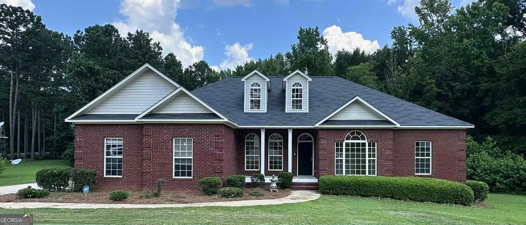 Welcome to your perfect blend of comfort, space, and style! This beautifully maintained 3 bedroom, 2 and a half bath home sits on nearly an acre of land in the peaceful Hidden Creek Community. This home offers both privacy and proximity to town conveniences. Step inside and you'll find an inviting layout with a dedicated office that's perfect for working from home or tackling your to-do list in peace. The spacious living area flows into a large dining space, ideal for entertaining or enjoying dinners at home. Enjoy your morning coffee, or a quiet evening, on the covered back deck, overlooking the expansive backyard with plenty of room for all kinds of activities. Additional features include a split bedroom floor plan, an owner's suite with double vanities and a walk-in closet, three car garage, and so much more. 418 Annie's Path offers the lifestyle you've been searching for in charming Jones County.