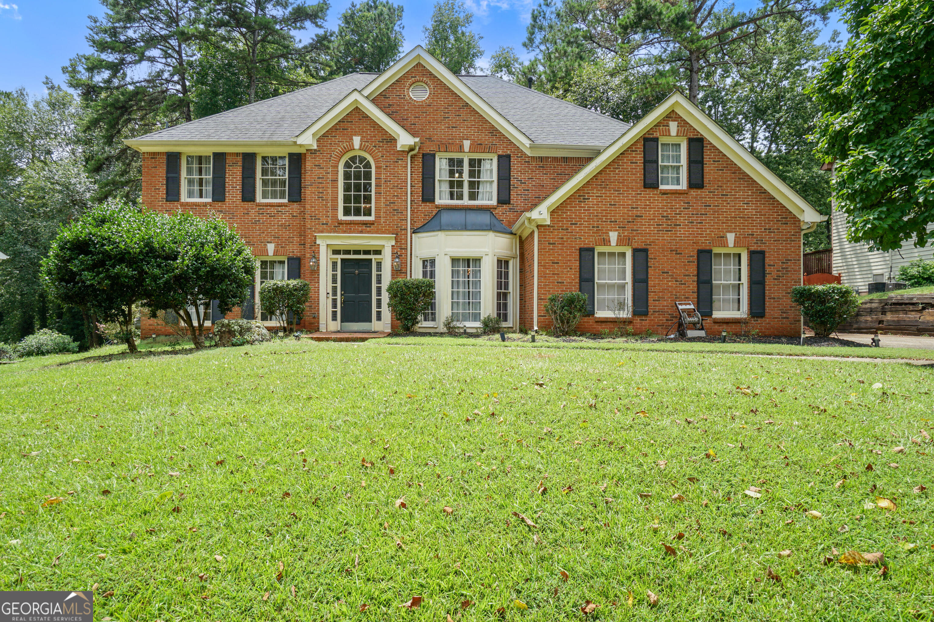Discover modern elegance with endless potential in this 4-bedroom, 2.5-bathroom home in the sought-after River's Edge Plantation. Ideal for open-concept living and multi-generational households, this property offers luxury, community charm, and a unique opportunity to customize. Being sold as-is, this home requires light cosmetic updates, making it an ideal canvas for buyers looking to add their personal flair. A grand 2-story foyer welcomes you into a cozy family room featuring a fireplace, vaulted ceilings, and large windows that flood the space with natural light. The main level flows seamlessly into a formal dining room and a gourmet kitchen equipped with stainless steel appliances and a double oven, ideal for entertaining. The master bedroom boasts a spa-like ensuite with a double vanity, separate shower, and soaking tub. Three additional bedrooms offer flexible functionality, easily serving as home offices, guest rooms, or spaces for children or extended family. A spacious laundry room and finished attic provide extra storage or a customizable bonus room. Step outside to an expansive backyard deck with a private, tree-lined view, ideal for outdoor entertaining or relaxation on this low-maintenance lot. With a few light cosmetic touches, this home can truly shine as your dream residence. Community Amenities: River's Edge Plantation offers resort-style living with tennis courts, a pool, clubhouse, playground, and a scenic lakeside trail, suited for all ages.