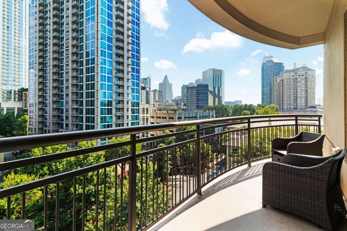 Welcome to refined high-rise living in the heart of Buckhead. This sunlit corner residence blends contemporary style with timeless elegance, offering the perfect balance of comfort and sophistication. From the moment you enter through the welcoming foyer, you're greeted with wide-plank luxury vinyl flooring that flows seamlessly throughout the home. The thoughtfully designed layout includes a dedicated dining area and a spacious great room framed by floor-to-ceiling picture windows ideal for both lively entertaining and quiet evenings at home. The updated kitchen features a wine rack, granite countertops, modern cabinetry, and newer appliances. The owner's suite boasts an oversized closet, while the flexible den provides the perfect space for a home office, library, or guest retreat. Step outside to your expansive corner balcony and savor breathtaking views that transform daily living into a resort-like experience. Life here extends far beyond the walls of your home. Enjoy mornings with coffee from the resident cafe bar, afternoons lounging by the sparkling pool with private cabanas, and evenings hosting friends in the wine room or private movie theater. For wellness and recreation, a state-of-the-art gym and elevated tennis court await. Use the grill to make steak dinners or roast marshmallows over the fire pit. It's all there for your enjoyment. When work calls, multiple conference rooms provide stylish, professional spaces steps from your front door. With 24-hour concierge service, secure covered parking, and lush landscaped grounds, every detail of this community has been designed to elevate your lifestyle. Marta, Lenox Mall and Phipps Plaza, and much more upscale restaurants, hotels and shopping are steps away from your front door. Georgia 400 and Interstates 75/85 are mere minutes away as you make your way to various destinations. Living here means more than owning a home, it's access to a curated way of life. This Buckhead address places you near Atlanta's finest dining, shopping, and cultural destinations, all while offering a serene retreat above the city.