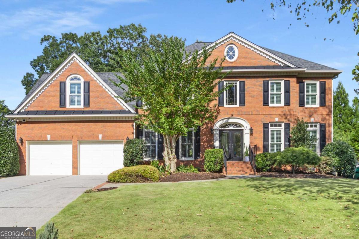 Incredible cul-de-sac home located in the coveted Whitehall community! Upon entry, a grand two-story foyer welcomes you, leading to a spacious office and a well-appointed dining room. The kitchen, featuring a premium Wolf cooktop, flows seamlessly into the breakfast nook and family room, which is enhanced by a cozy fireplace, built-in shelving, a wet bar and views of the meticulous backyard. Upstairs, the oversized primary bedroom offers dual closets and a luxurious bathroom with vaulted ceilings, soaking tub, updated shower and freshly painted cabinets. Three additional bedrooms and two full baths are thoughtfully separated from the primary suite, providing privacy and comfort. The third-floor bonus room, complete with a full bathroom, offers versatile space ideal for a game room, movie nights, and additional entertaining space. The luxuriously landscaped backyard features a stone patio with ample room for seating, grilling, and outdoor dining. An additional area is perfectly suited for a conversation circle with chairs and a fire pit, creating an inviting atmosphere for gatherings. This home enjoys a prime location close to all the amenities of Dunwoody/Sandy Springs and offers convenient access to Highway 400.