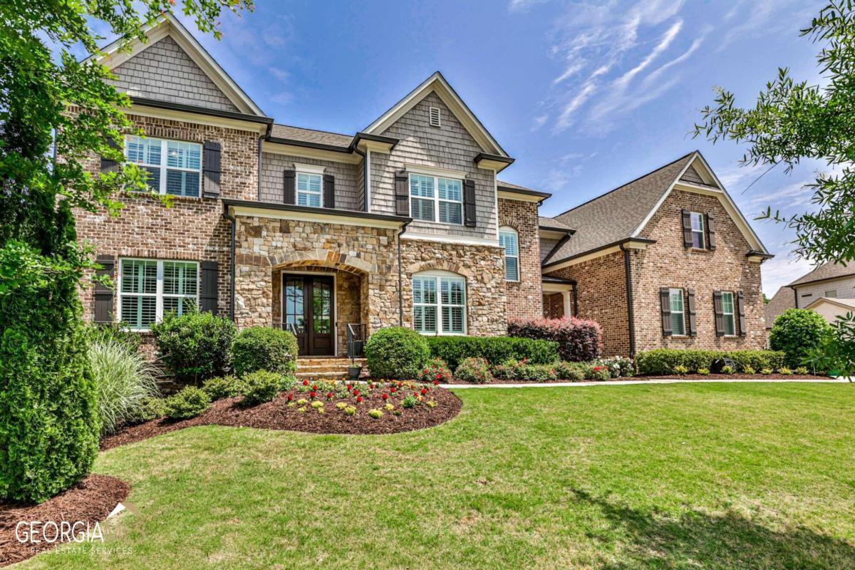 On a quiet cul de sac street in the heart of Sandy Springs, this 2016 Edward Andrews built home shines like new from the minute you enter the beautiful double-stained front doors. An open main level floorplan including an office, dining room, and full bedroom suite. Enjoy fireside entertaining and relaxing in the family room or cozy keeping room off the gourmet kitchen with custom cabinetry and Kitchen Aid stainless appliances, sure to make any meal a breeze! Walk out onto the newly stained deck and covered dining area as you overlook the fenced, level, professionally landscaped backyard. They thought of everything as they made the selections during the building process including upgraded moldings from floor to ceiling, stained beans, coffered ceilings, hardwood floors, quartz countertops, tile, lighting, custom closets, and the list goes on....As you continue to the upper level to a beautiful primary suite with a luxurious spa bath with a slipper tub, double vanities, and a large shower with frameless glass. As well as 3 additional bedrooms all ensuite, laundry room, and raised media room. The large finished terrace level provides ample space for guests in the airy guest room and full bath, entertaining space, storage, and walk-out covered patio, ready for additional customization to meet your needs. Side-facing 3-car garage on kitchen level with storage. Ideal location with easy access to everything, come take the tour!