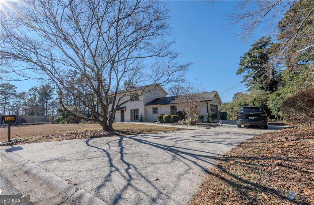 Photo of 1499 Smokehouse Ln, Stone Mountain, GA 30088 (MLS # 10660362)