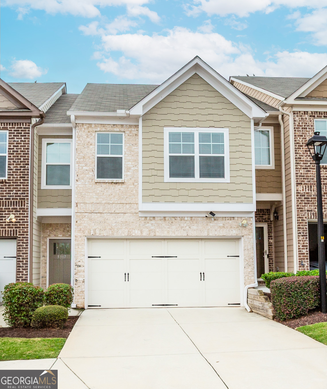 *Prime location -just off Covington Hwy in Lithonia, you'll be minutes from shopping, grocery stores, dining, and have quick access to I-20 for an easy commute. Welcome home to this immaculate 3-bedroom, 2.5-bath townhome designed with modern elegance and everyday convenience in mind. From the moment you step inside, you'll be greeted with abundant natural light, soaring ceilings, and an inviting open-concept floor plan perfect for both relaxing and entertaining. You will love the seamlessly connected living, dining, and kitchen areas with gleaming hardwood floors. Gourmet kitchen with beautiful granite countertops, white cabinetry, and stainless steel appliances, including a side-by-side refrigerator with an interactive screen to watch television while cooking or hosting. Make the private owner's suite your own oasis with a spa-like bathroom featuring a soaking tub, separate shower, double vanity, and a spacious walk-in closet. There are two additional large bedrooms on the upper level featuring plush carpeting for comfort. Make the backyard your escape with a fully fenced-in yard, perfect for pets, gatherings, or your own private sanctuary. There is ample parking with a 2-car garage plus a driveway that fits two additional vehicles. In this community, you will have worry-free living as lawn care is covered by the HOA, giving you more time to enjoy life! Don't miss the chance to call this stunning property home!!!
