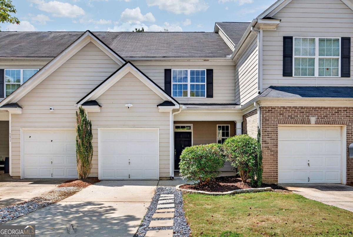 Move-In Ready Townhome in Stonebridge - Newnan, GA. Beautifully maintained 3-bedroom, 2.5-bath townhome located in the desirable Stonebridge community of Newnan. Built in 2009 and thoughtfully updated, this home is perfectly move-in ready with modern comfort and peace of mind. Recent upgrades include a brand-new roof (2025), new HVAC system (2025), and new carpet throughout. The inviting open-concept floor plan features a spacious family room that flows seamlessly into the dining area and kitchen. The kitchen is designed with solid surface counters, ample cabinet space, and a view to the family room, making it an ideal hub for entertaining or casual meals. Upstairs, the oversized primary suite offers a relaxing retreat with a large walk-in closet and private bath. Two additional bedrooms and another full bath provide flexibility for family, guests, or a home office. Enjoy the community amenities, including a clubhouse, pool, playground, tennis courts, and sidewalks for leisurely strolls. Stonebridge is also just minutes from Ashley Park shopping and dining, Piedmont Newnan Hospital, and Historic Downtown Newnan. Convenient access to I-85 makes commuting to Atlanta or Hartsfield-Jackson Airport a breeze. This townhome combines modern upgrades, community living, and unbeatable location - all at a great value. Don't miss your chance to make 153 Granite Way your new home! Schedule your showing today.