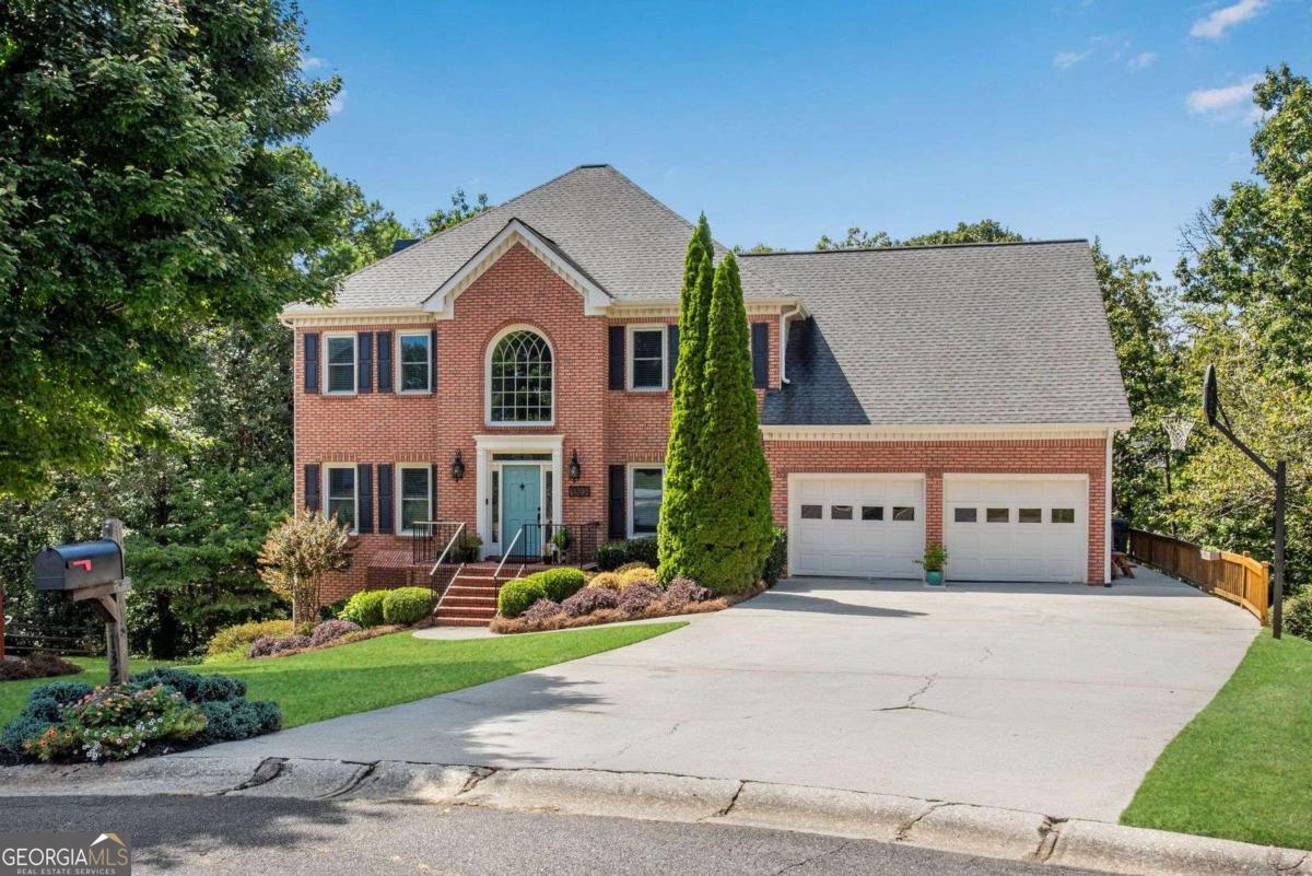 Welcome to this spacious brick home nestled on a cul-de-sac lot in Walkers Ridge North, a delightful swim and tennis community in the heart of West Cobb with a 2-car garage, fenced-in backyard, & full unfinished basement! This immaculate home blends functionality & space seamlessly. The curb appeal shows off a grassy front yard, landscaping, & shade tree. As you enter through the front door, you are greeted by a 2-story foyer w/ lantern chandelier, hardwood floors, & an open living room that is great for a home office. The formal dining room to your right connects to the large kitchen featuring wood cabinetry, sleek SS appliances, granite countertops, an RO water filtration system, & kitchen peninsula showcasing tongue & groove backing w/ overhang for bar seating! Bay windows surround the spacious breakfast area creating a light-filled retreat w/ views of the backyard! The kitchen flows into the open family room that is anchored by a brick fireplace & floating wood shelves making it the perfect place to gather. Exterior door leads directly out to the back deck & covered back porch great for entertaining with backyard views! Through the kitchen, uncover a fabulous mudroom area at garage entrance, the main floor half bath, a generous Pinterest worthy walk-in pantry, & a large updated laundry room w/ sink, folding surface, storage cabinets, & built-in clothing rack! Back staircase leads up to a fantastic bonus room which could become a 5th bedroom or use it as a playroom, home office, media room, or anything else to suit your needs! Make your way down the hall to discover the oversized primary bedroom featuring tray ceiling w/ new fan, sitting area by the windows, & massive walk-in closet! Luxurious remodeled primary bathroom has a subway tiled shower w/ frameless glass door, clawfoot soaking tub placed in front of the picture window, dual vanity w/ make-up area, new lighting, tiled floors, & private water closet! Also located upstairs are 3 additional perfectly placed bedrooms & a spacious updated full bathroom w/ double vanity, new hardware, new sink faucets, & new lighting. From the family room, make your way down to the full unfinished basement that has a workshop area, multiple rooms, & 2 exterior doors. This space is great for storage now or you have tons of options in future to finish to your liking. Head outside to the totally fenced-in low maintenance backyard that has a level grassy area, lush landscaping, & a wall of trees that make it completely private! Additional upgrades include new carpet in the FR, entire interior of home has been recently painted, New R38 insulation in the attic, & tons of new windows throughout! The neighborhood amenities include a swimming pool, tennis/pickleball courts, basketball goal, plenty of parking, a little free library, and it is situated in a top-rated school district! West Cobb offers tons of shopping & dining on Barrett Parkway & Dallas Highway & is located only minutes away from West Cobb Avenues, Kennesaw Mountain hiking trails, & the Marietta Square making it the ideal place to be!