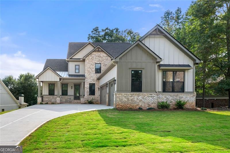 Welcome to this exceptional home in Traditions of Braselton, offering over 3,500 square feet of finished living space plus a 2,134 square foot unfinished basement with endless potential for customization. The floor plan is thoughtfully designed with two primary suites- one on the main level, featuring LVP flooring and a spa-inspired bath, and another upstairs-making it the perfect long-term home for families, multi-generational living, or empty nesters seeking comfort and flexibility. As you enter, you are welcomed by soaring ceilings and a double-height living area that fills the home with natural light and creates an inviting sense of openness. A versatile flex space on the main level offers the perfect setting for a private office, study, or playroom. The kitchen is a true centerpiece, featuring ceiling-height cabinetry, modern finishes, a built-in wine rack with chiller, and a wet bar/coffee bar that enhances both everyday living and entertaining. Attention to detail is evident throughout with custom wall treatments, stylish fixtures, and beautiful wood accents that provide warmth and character. The interior fireplace adds charm and comfort, while the outdoor fireplace anchors the generous exterior living space, perfect for gatherings or quiet evenings. Upstairs, secondary bedrooms are complemented by a spa-inspired bath experience, with both primary suites featuring shower and tub combinations designed for relaxation. The home is completed with a three-car garage featuring soaring ceilings, offering ample storage and utility space. The unfinished basement provides incredible potential for future customization-whether you envision additional bedrooms, a game room, a theater, or a home gym, the options are limitless. This residence combines elegance, functionality, and modern style, making it one of the most desirable floor plans in Traditions of Braselton. Schedule your showing today and discover a home that is truly move-in ready with room to grow.
