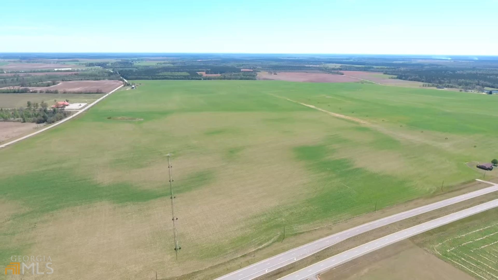 Stapleton GA - Crossroads Farm - 508.53 Acres Irrigated Farm This 508.53 acre farm is composed of eight Tax Parcels and is located a few miles South of Stapleton, Ga at the intersection (crossroads) of Hwy. 88 (Ga 540) and Hwy. 296. The property boast 6000 feet of road frontage on Hwy. 88, 5000 feet of road frontage on Hwy. 296 and 5000 feet of road frontage on John Sheppard Road (county maintained paved and dirt). The fertile, well drained. Mostly level land consists of Orangeburg and Dothan soils which is irrigated by five Zimmatic Irrigation Systems (average 2-4 years old) that water 490.97 acres (96% irrigated). The irrigation water is supplied by two 16 inch (250HP 3phase) wells and one 14 inch submersible well. The three wells are connected together for maximum water supply capacity. Of the five pivots located on the farm, pivot one commands a total of 367.95 acres under one irrigation circle. The other four irrigation systems make only semi circles. Also located on the farm is two 24,000 bushel grain bins (3 phase) with blower fans and grain loading staging area. Additional irrigation specifications, soil samples and cropping history is available upon request. Seller would be interested in leasing the farm if investor purchased. Additional irrigated farmland available within 7/10 mile.