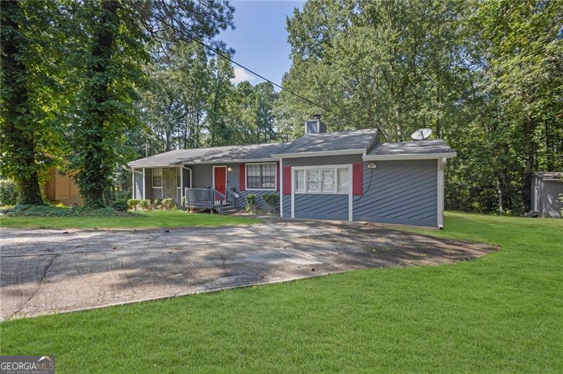Great Opportunity in Riverdale! This home was completely renovated in 2013 and features a brand-new HVAC system. The interior boasts a spacious, updated kitchen with stained wood cabinets, sleek black appliances, and a convenient island perfect for quick meals. You'll also find a separate dining room, ideal for family dinners, and a living area with a cozy wood burning fireplace. Outside, a private back patio leads to a large backyard, perfect for outdoor activities and relaxation, and there's a small shed for additional storage. This property is ideally located close to I-75, Clayton State University, and Hartsfield-Jackson International Airport, making it an excellent option for either a new homeowner or an investor.