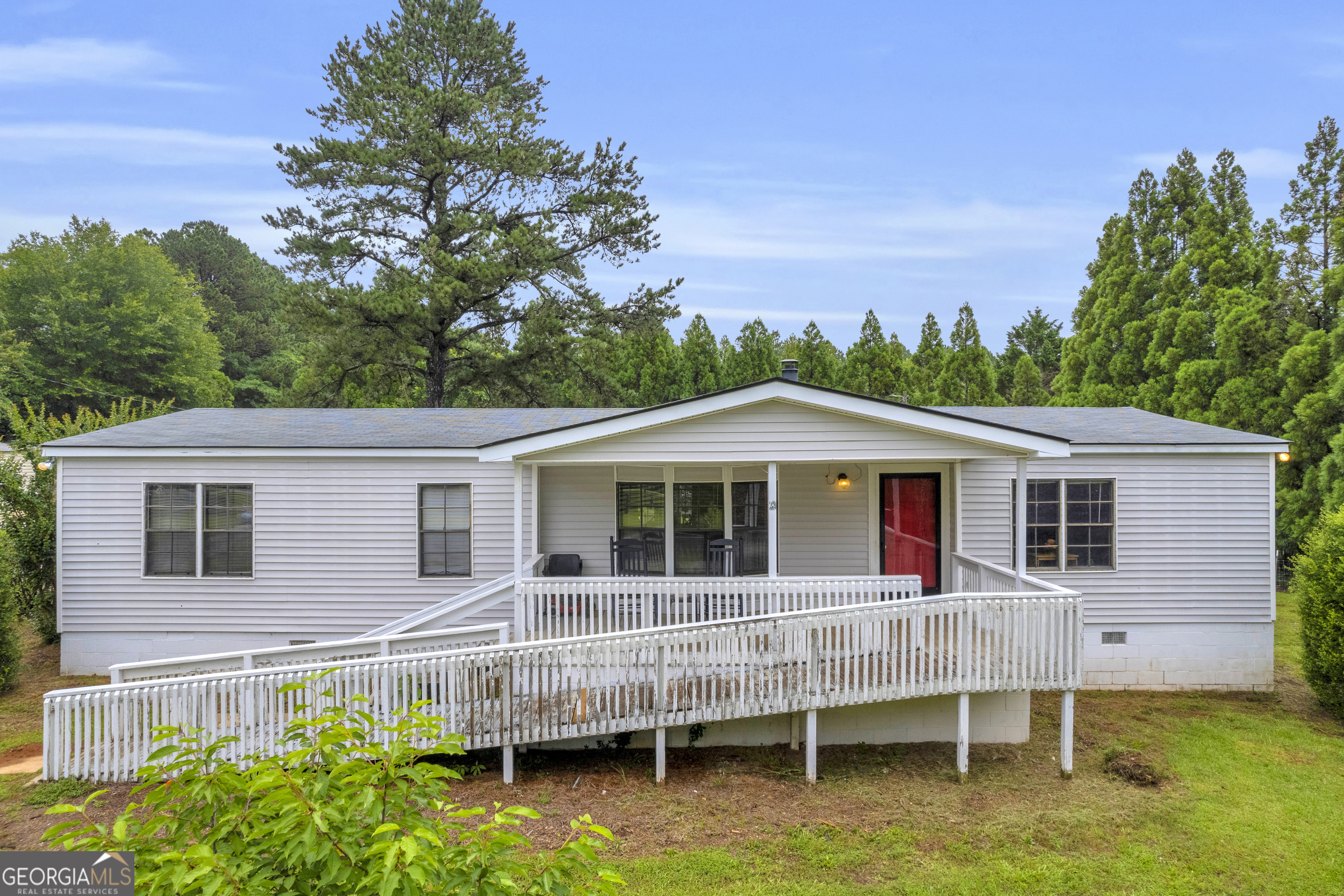 Coming Soon!! Spacious Home on 2.46 Acres in Bishop, GA - North Oconee School District. Located in the heart of Oconee County, this 3 bedroom, 2 bathroom double-wide mobile home offers 1,792 square feet of living space on a beautiful 2.46-acre located in the highly sought after North Oconee School District. Enjoy the peace and privacy of country living while still being just minutes from Watkinsville, schools, and local conveniences. The home features a large open floor plan with a generous living area, spacious kitchen with storage and dining space, and a split bedroom layout offering privacy and comfort. The primary suite includes a walk-in closet and private bath, while two additional bedrooms and a second full bath complete the home. The expansive, level lot offers plenty of space for outdoor living, gardening, or simply relaxing and enjoying the quiet setting. This property offers a great opportunity to personalize and make it your own. As-Is. Come explore the possibilities and picture your future here in Bishop! Appointment required.