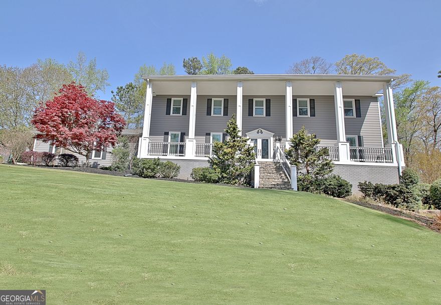 Experience Southern Charm in Smokerise Plantation of Peachtree City, GA. Video Tour see https://youtu.be/7gvLbarnKrQ   Seasonal Lake Kedron view from Rocking Chair Front Porch. Spacious w/ 5827 sq ft heated and cooled space! Beautiful and inviting 5 Bedrooms, 4 Full Baths, 2 Half Baths+ office on main or 2nd floor, Screened Porch, 3 car garage (one bay approx 32' deep) & Finished Daylight Terrace Level! Flex space upstairs for playroom, office, Retreat, media room or 6th BR.  Lots of **upgrades and home improvements over $265K WOW** - Remodeled: Terrace level & added 1/2 Bath, added Hardi Plank siding to 3 sides of home, Front Porch, replaced windows w/Simonton 500 series Triple Pane Glass, deck and Screen porch remodeled/Fiber board decking, Anderson screen doors, PVC columns and trim and more. Smart home features:  60A ChargePoint EV charger, Rinnai tankless water heater, Ecobee thermostats, Ring doorbells and security system, Rachio smart irrigation system, Chamberlain my-Q garage opener, and CAT 5/6 cable run throughout the house to allow mesh network and multiple other WiFi-enabled devices (TVs, Alexa, gaming systems, etc). Protected with two whole home surge protectors hardwired inside each panel. Enjoy this gorgeous Re-landscaped yard with sprinkler system, Zoysia installed/tree removal, Plantation shutters, remodeled bathroom, Tankless H2O heater and more! Not only can this lovely home hold all your furniture and treasures it is located in the popular Estate neighborhood of Smokerise Plantation in north Peachtree City and sought after McIntosh HS district. The Guest Bedroom Suite / on the main could be In-Law suite or Home Office. All formal areas with Hardwood floors. Lg Dining Rm can hold extended seating for special occasions! Kitchen with Granite, Stainless Steel Appliances and Island/B-Bar opens to Breakfast area and Family Room. Laundry Rm on main is large with oversized storage closet and 1/2 Bath. Gather daily in the Family Room which is anchored with brick fireplace and flanked by built-in bookcases. Wall of glass doors bring the 1 acre of outdoors inside. Enjoy the renovated Screen Porch and deck with composite decking. Four secondary bedrooms will be the largest you can find. They share 2 full baths with one newly renovated! Relax in your Master BR Suite with private bath, dual vanity, lg tiled shower, jetted soaking tub and walk-in closet.  One Room up could be Media/Owner Retreat area or Home Office. Recreation galore in full daylight terrace level.  Home theatre room has bar area and kitchenette great for entertaining. adjoining areas include a game room , 1/2 bath, office or exercise room and tons of storage areas.  The Zoysia lawn and lovely landscaping is stunning in the 1 acre yard. Take a golf cart ride from home on the 100+ miles of paved Golf Cart paths to Stores, Recreation, Top Ranked Schools, Country Clubs, Golf courses and lakes! Come enjoy Peachtree City an award winning Master Plan community Outside of Atlanta nd the International airport. Closing is Flexible - Buyer can move in and close before school starts or later!