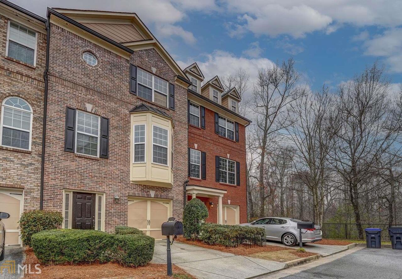BACK ON MARKET. BUYERS FINANCING FELL THROUGH. No Seller's Property Disclosure. Beautiful 3 Bed / 3.5 Bath Townhome located in Buford walking distance to Mall of Georgia!Open floor-plan concept, large family room with fireplace .Home offers fresh paint throughout and beautiful hardwood floors in kitchen & terrace foyer. Brand new blinds ,Kitchen features new stainless appliances, granite countertops, and breakfast bar.Newly painted deck off the family room is perfect for entertaining. Upstairs has two large bedrooms. A must see !