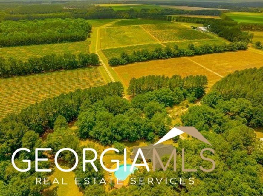 Introducing The Jarrell Farm Retreat! This farm is located in the growing area of Screven County just off of HWY 21!   The Jarrell Farm features 110 irrigated acres of vineyard that produces Muscadine, Black Supremes, Granny Vals, Early Fried, Tara, & Nesbit grapes. The grapes from this farm may very well in your local Publix, Walmart, Aldi, Kroger, etc. This is a working vineyard that produces extraordinary returns. The irrigation system that waters the vineyard is run off of two separate wells; a 4 inch & 6 inch well. There are stretches of gorgeous plantation pines that separate all of the field areas. The acreage around The Jarrell Farm is in some of the best shape I have ever seen on a farm. The property has a Guest suite (The Quad), which includes four 1 bed/1 bath living spaces. The quad would be perfect for large family gatherings, or any type of business venture the new owner sees fit.  All 4 units have been completely renovated with hardwood floors, stainless steel appliances, LED lighting, new roof coatings, ridge caps, & additional laundry facility. There is also a dormitory with 35 beds, 14 newly installed toilets, two hot water heaters, two brand new 5 ton A/C units, stoves, refrigerators, & 6 washer and dryer connections. The Packing House boasts four brand new compressors, new wiring and ceiling in the office spaces, LED lighting, triple wash sinks, five loading docks, & two 10x30 coolers. The possibilities for this property are endless.   There is a beautiful 5 bed/3bath, 3300 square foot main house tucked away in the very back of the property! The scenery around the home is remarkable. Some of the nice features of the home include: a 2 car carport, brand new kitchen appliances, wood burning fireplace, brand new flooring throughout, as well as a brand new roof! To top it off, the property features a chlorine pool with its own bathroom for your family to enjoy during the hot summers.   Outside of the vineyard, the land consists of pre merchantable & merchantable pine timber, and multiple beautiful hardwood bottoms. The road network on this property is top notch. There are numerous potential food plot areas for the outdoorsman. Deer and Turkey have been regularly seen on the farm, and the sign is evident. The property is bordered by 600 acres of Weyerhaeuser Timberland & 1000 plus acres of bordering irrigated farms, which further enhances the hunting potential and privacy on this tract. Enjoy 226 acres of pristine land in one of the fastest growing areas in the country. This is a near turnkey property for the right buyer, and the renovations & rehabs should not go unnoticed. If you are in the market for such property, then The Jarrell Farm may be the one for you. Properties such as this rarely see the market anywhere in the country. The Jarrell Farm is 1 Hour & 20 Minutes from Savannah, 1 Hour & 30 Minutes from Augusta, 3 Hours & 30 Minutes from Atlanta, & 2 Hours & 30 Minutes from Macon!